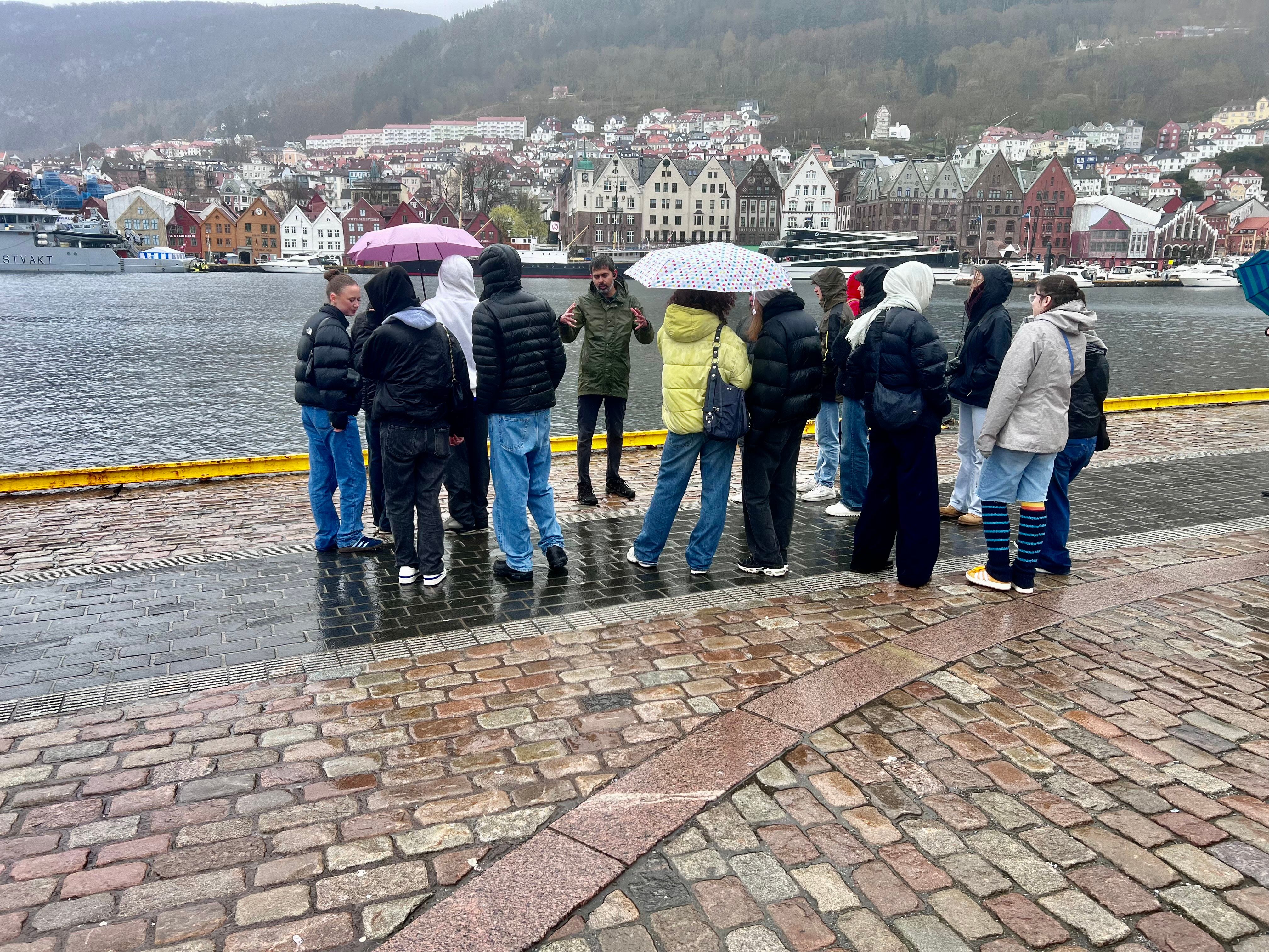 Visiting students take in Bergen in its elements. Strandkaien.