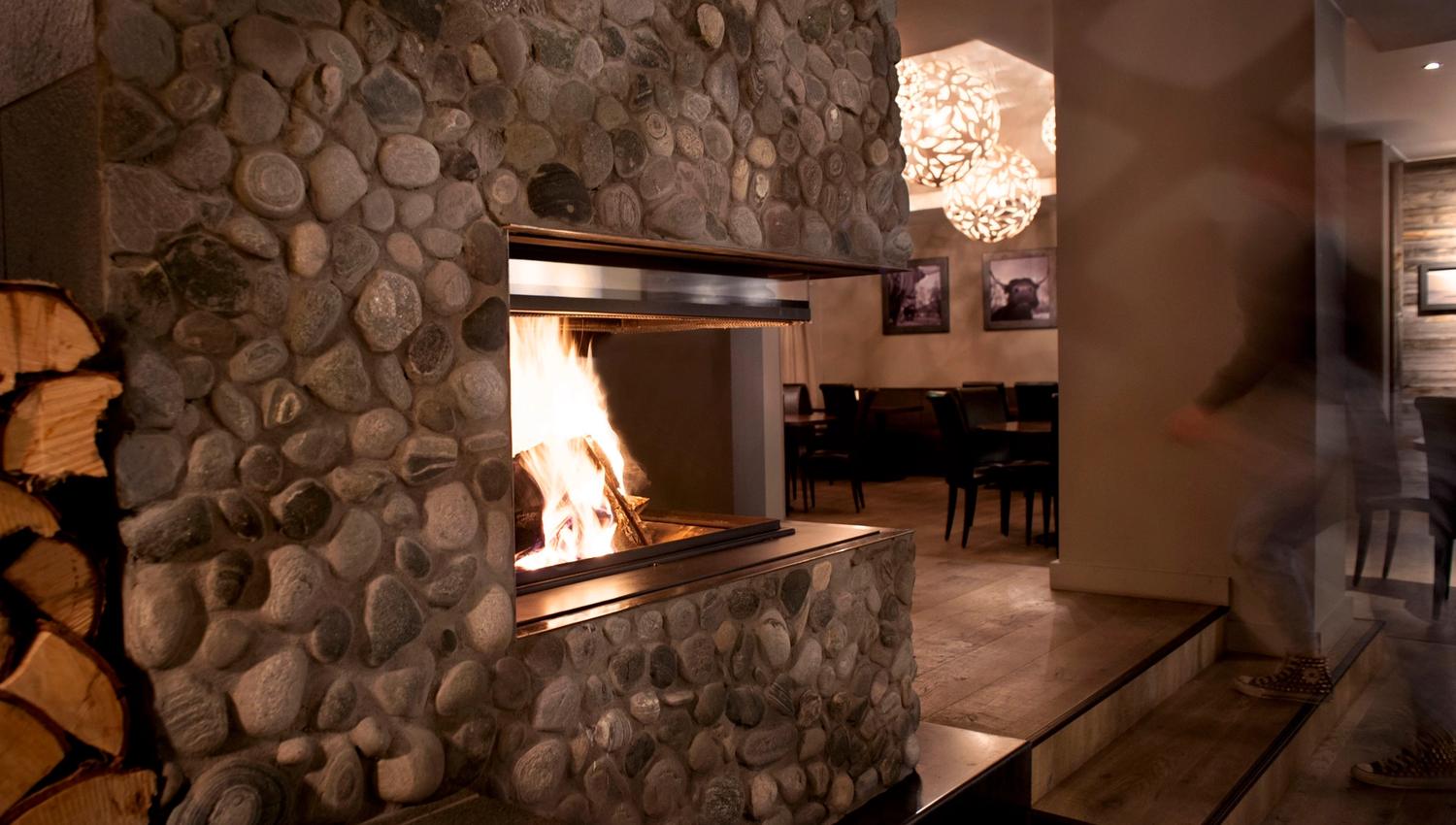 Fireplace inside a wall decorated with stone