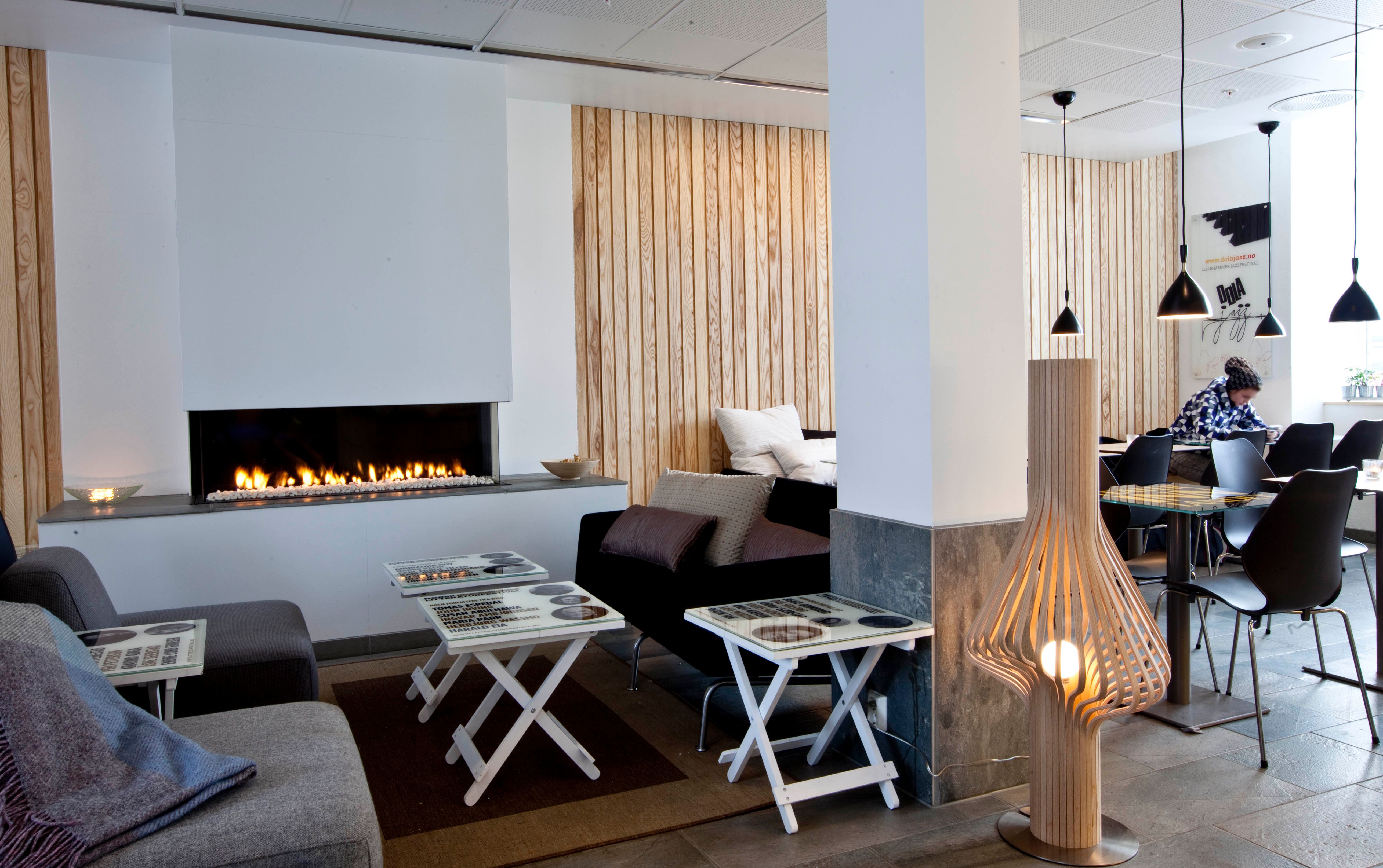Nice atmosphere by the fireplace at Stasjonen Cafe & Restaurant