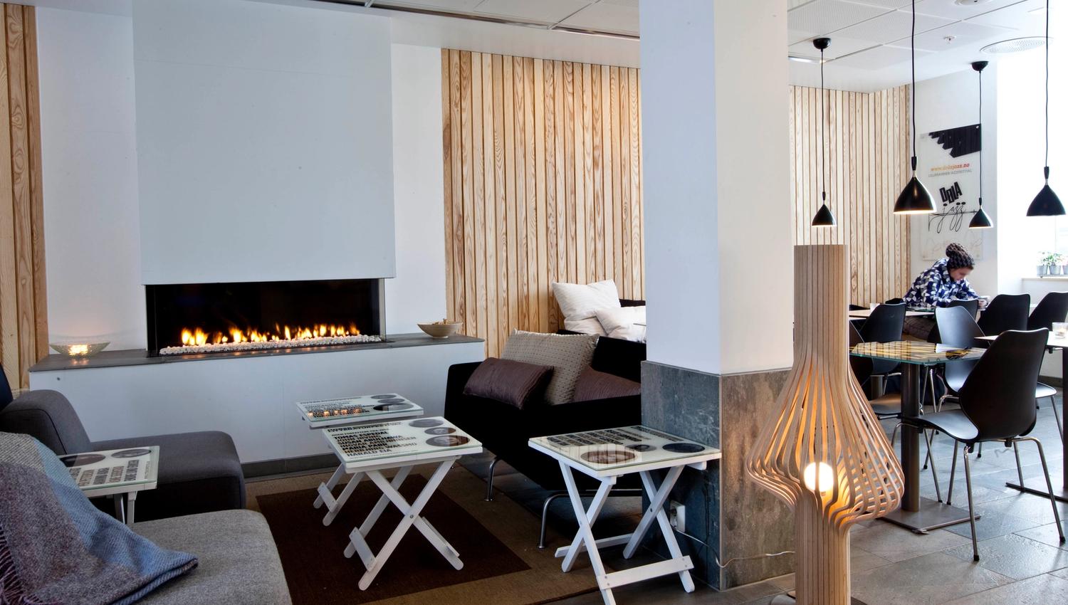 Nice atmosphere by the fireplace at Stasjonen Cafe & Restaurant