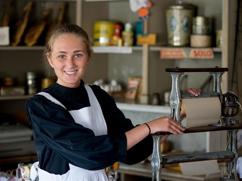 Shopgirl in old grocery store. Norwegian Museum of Cultural History