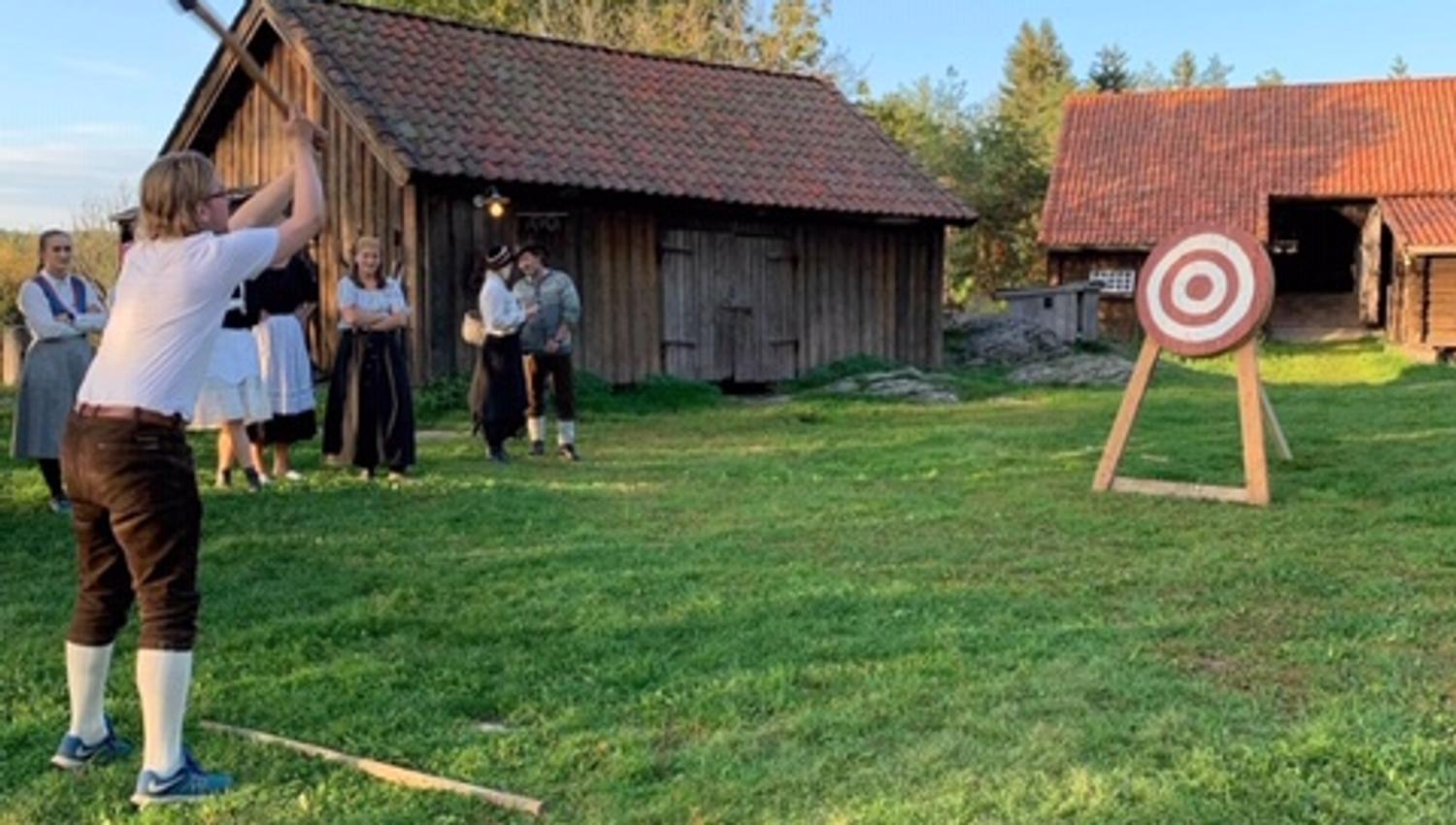 a man throwing an axe at a target