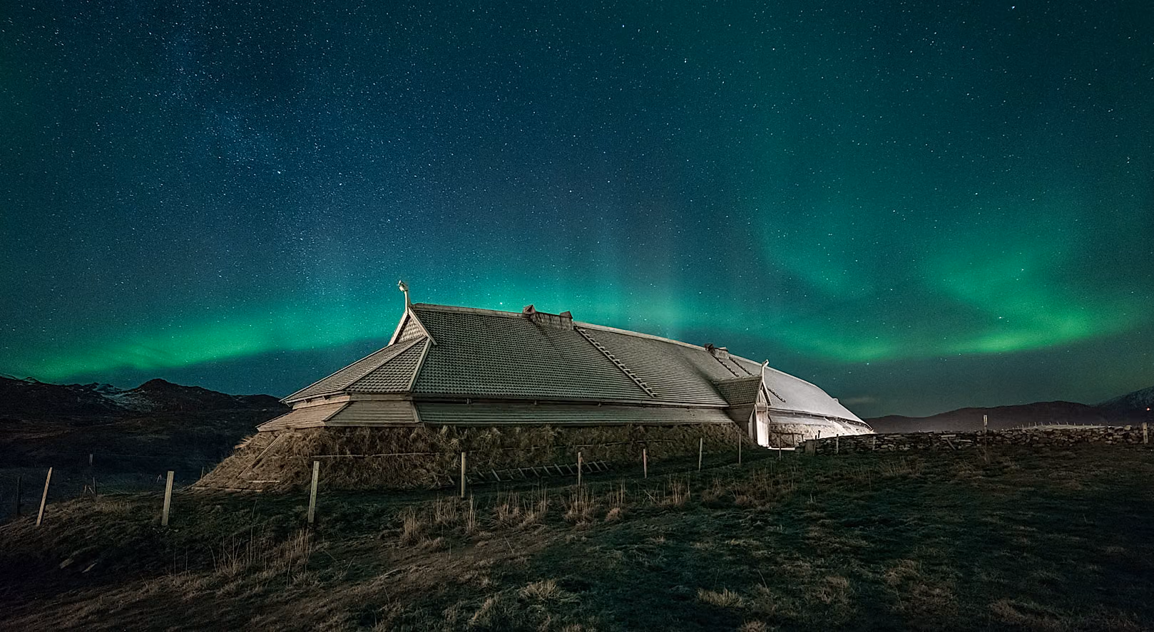 Viking longhouse under northern lights in Borg in Lofoten