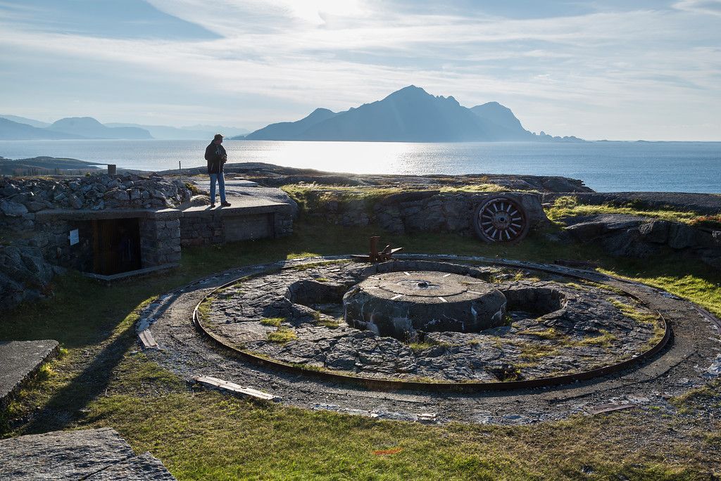 A man looking at parts of a fort.