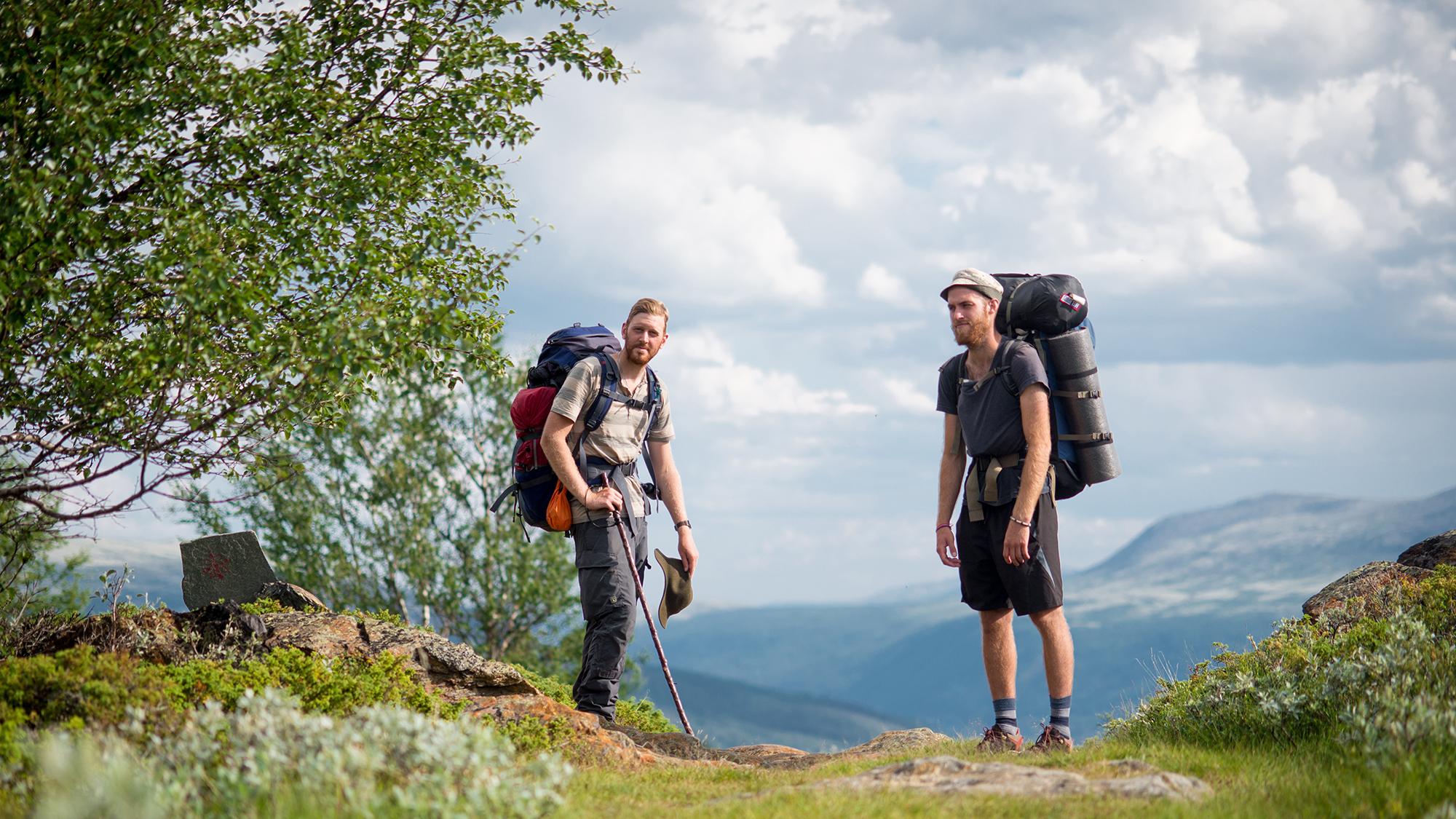 Two man with backpacks during a pilgrimage in Dovrefjell, Eastern Norway