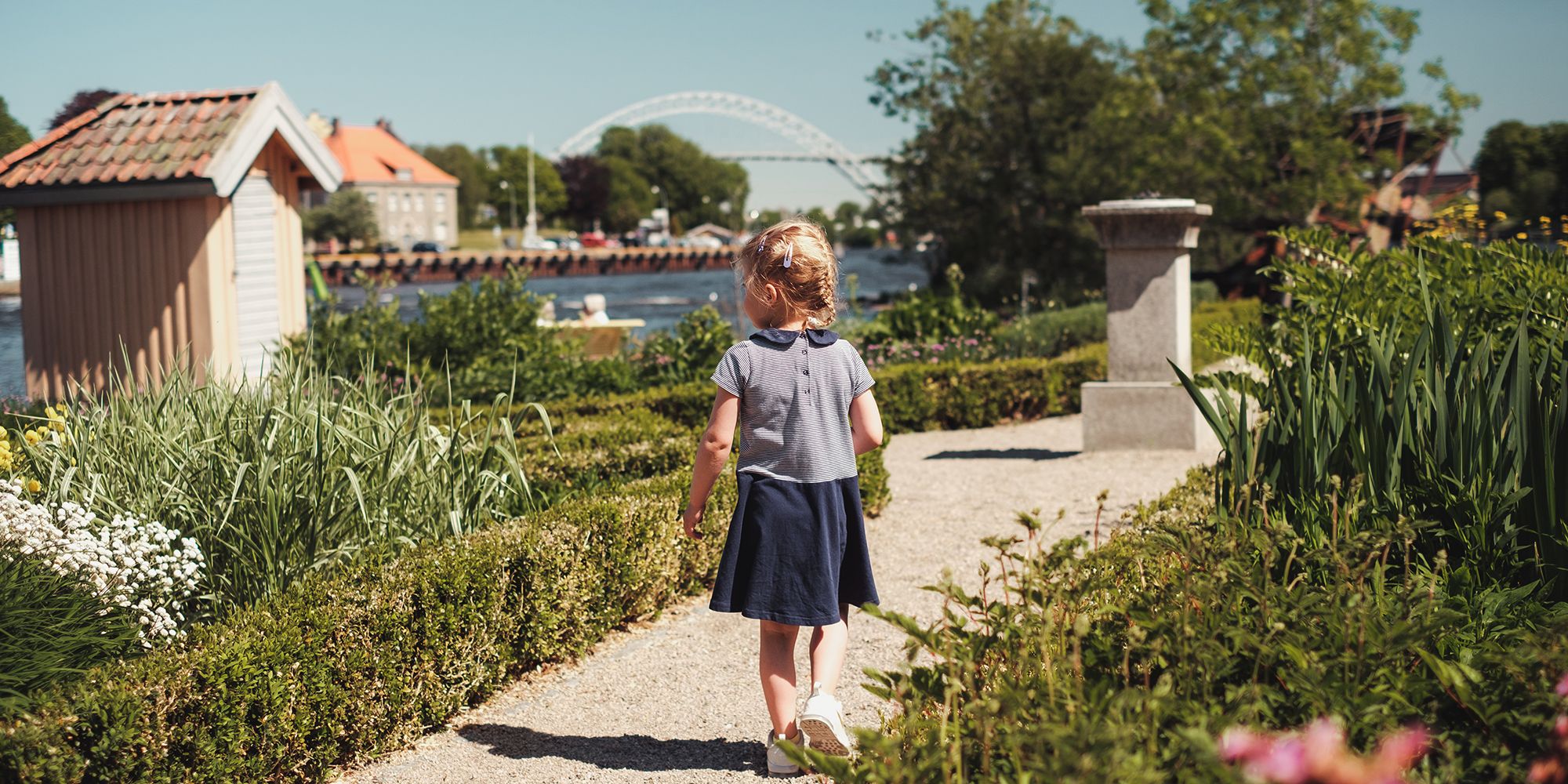 A girl walking in a garden on the island Isegran in Fredrikstad, Eastern Norway