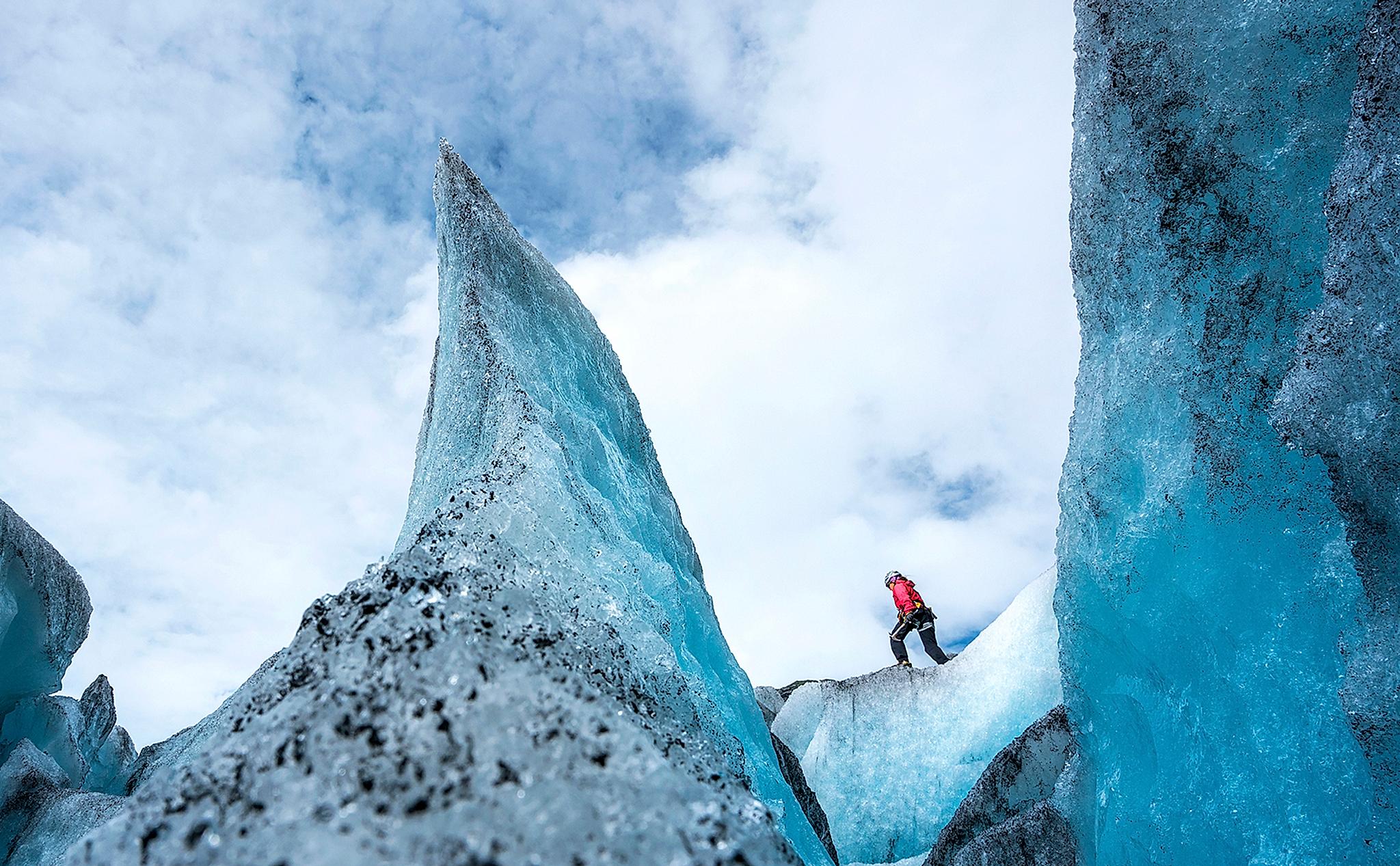 A person is hiking on the Nigardsbreen glacier in the Jostedalen valley in the Sognefjord area of Fjord Norway