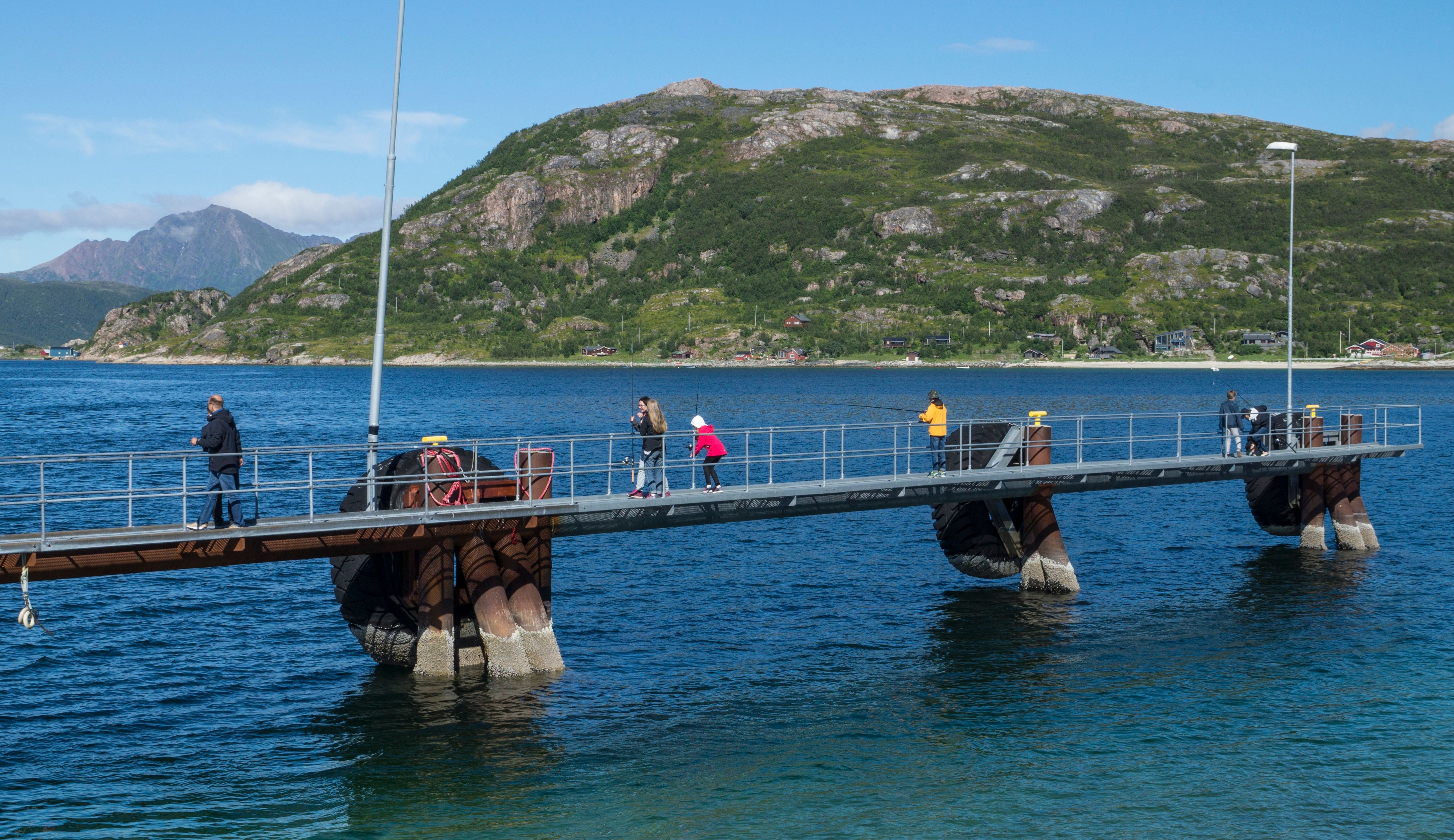 People fishing from a pier 