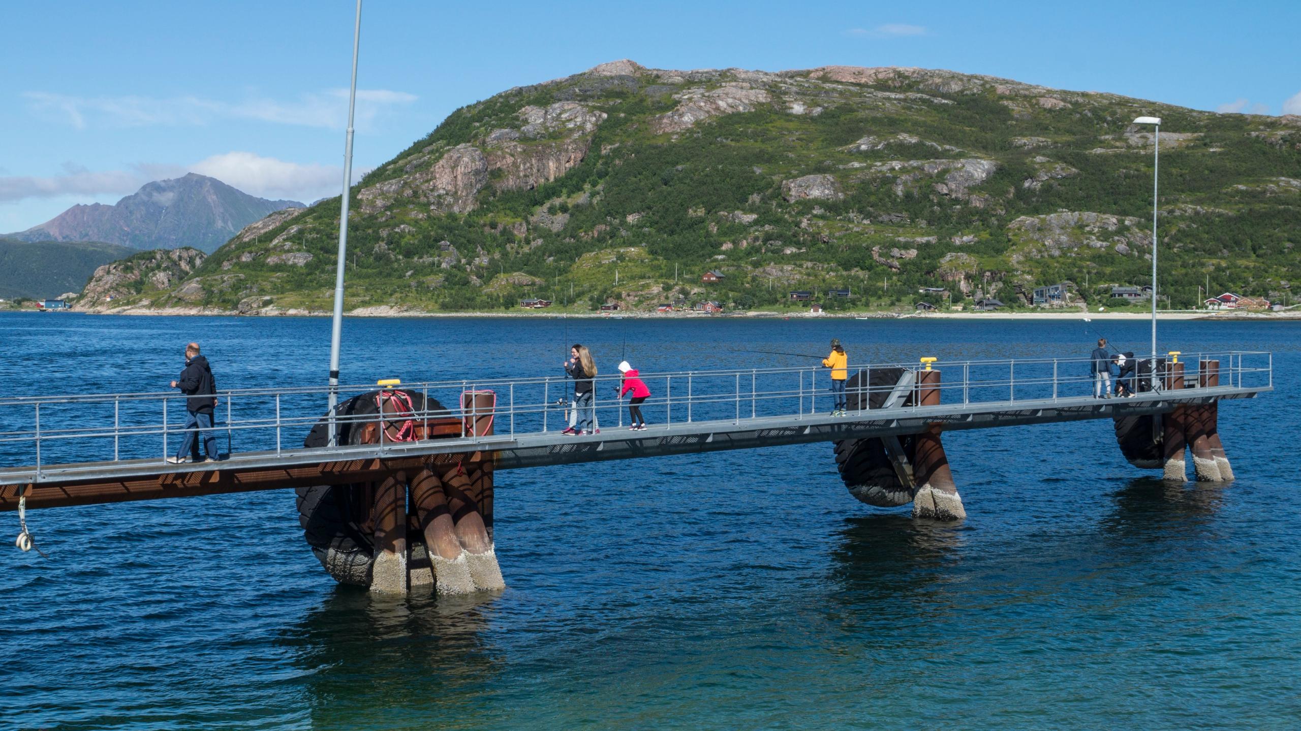 People fishing from a pier