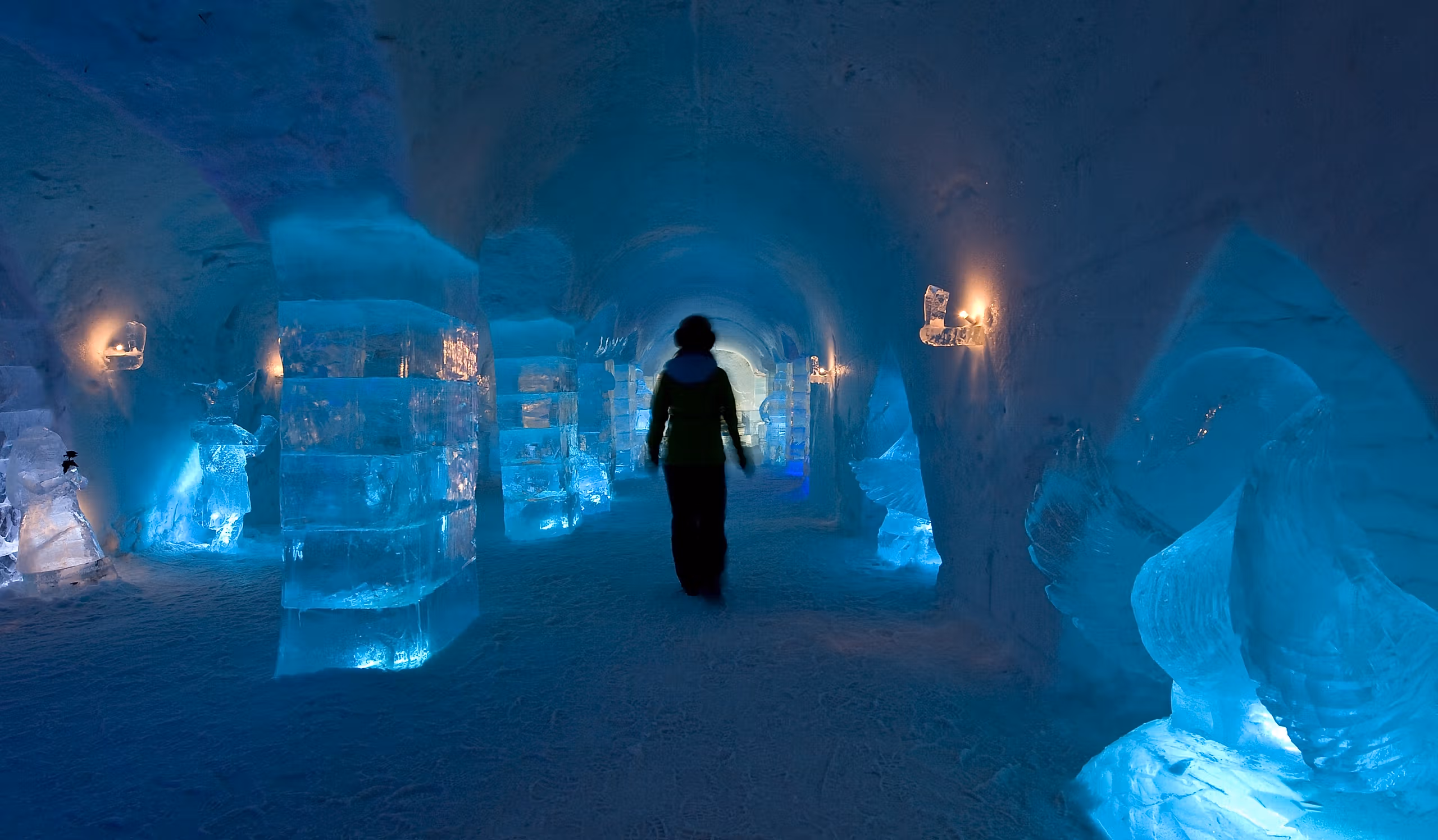 Person inside Sorrisniva Igloo Hotel, in Alta