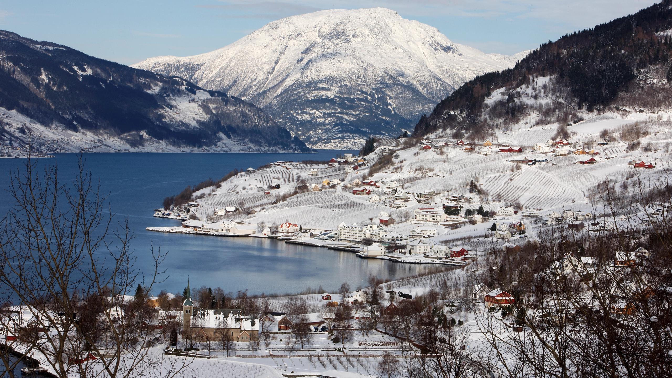 The charming village Lufthus by the Hardangerfjord in Fjord Norway, covered in snow.