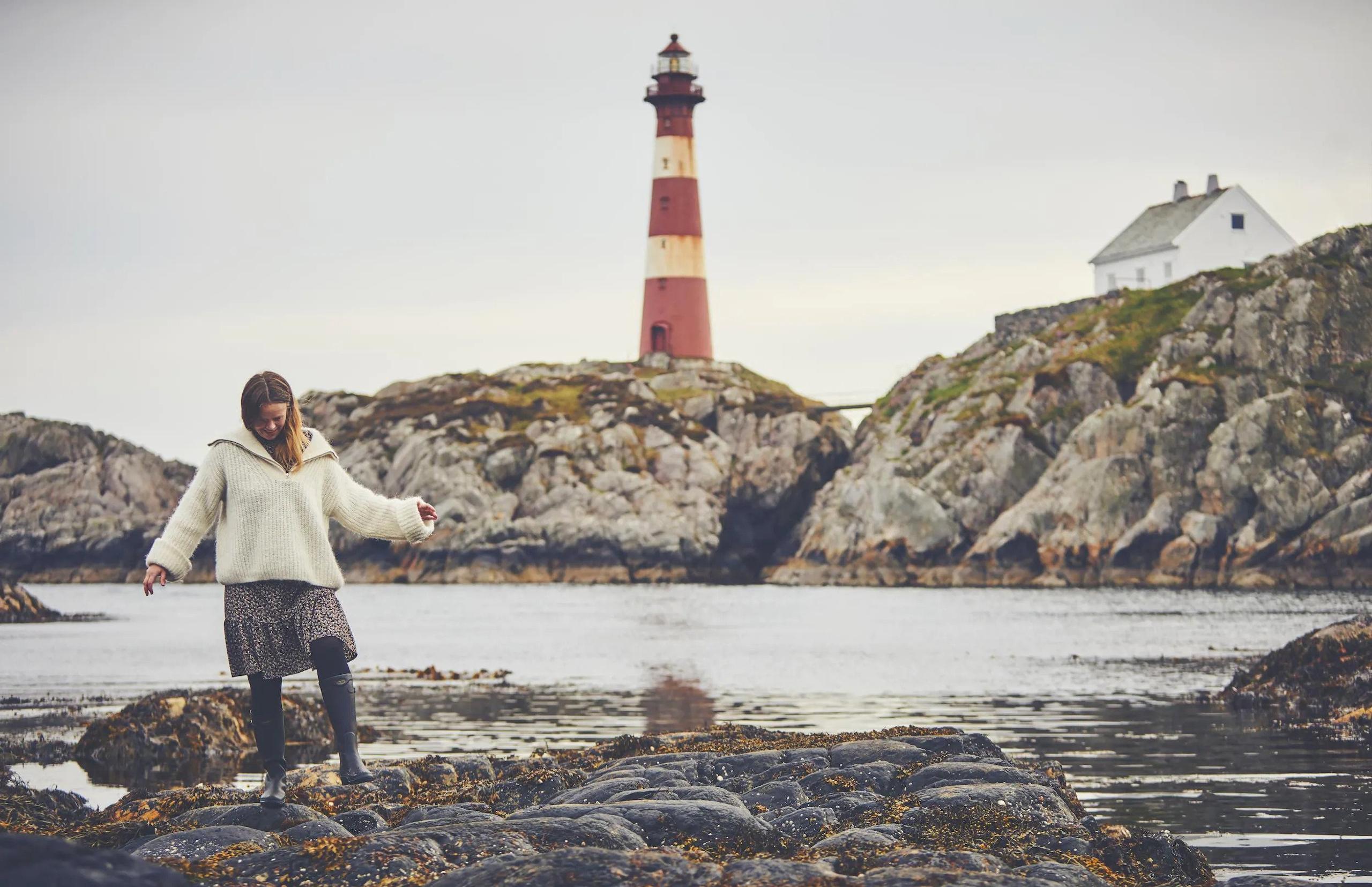 Women in front of lighthouse