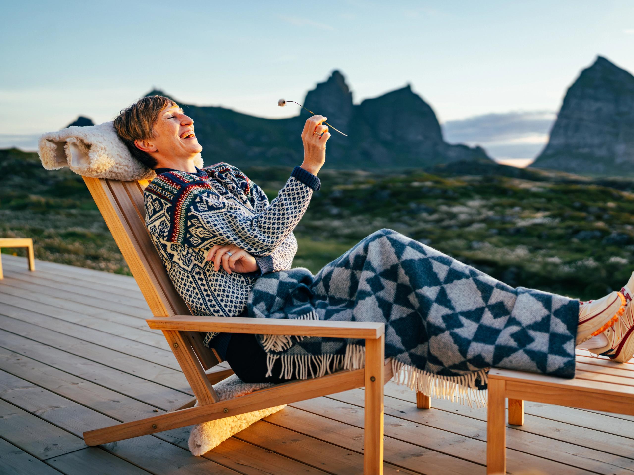 A Woman in a chair at Ytri Island Retreat at Træna