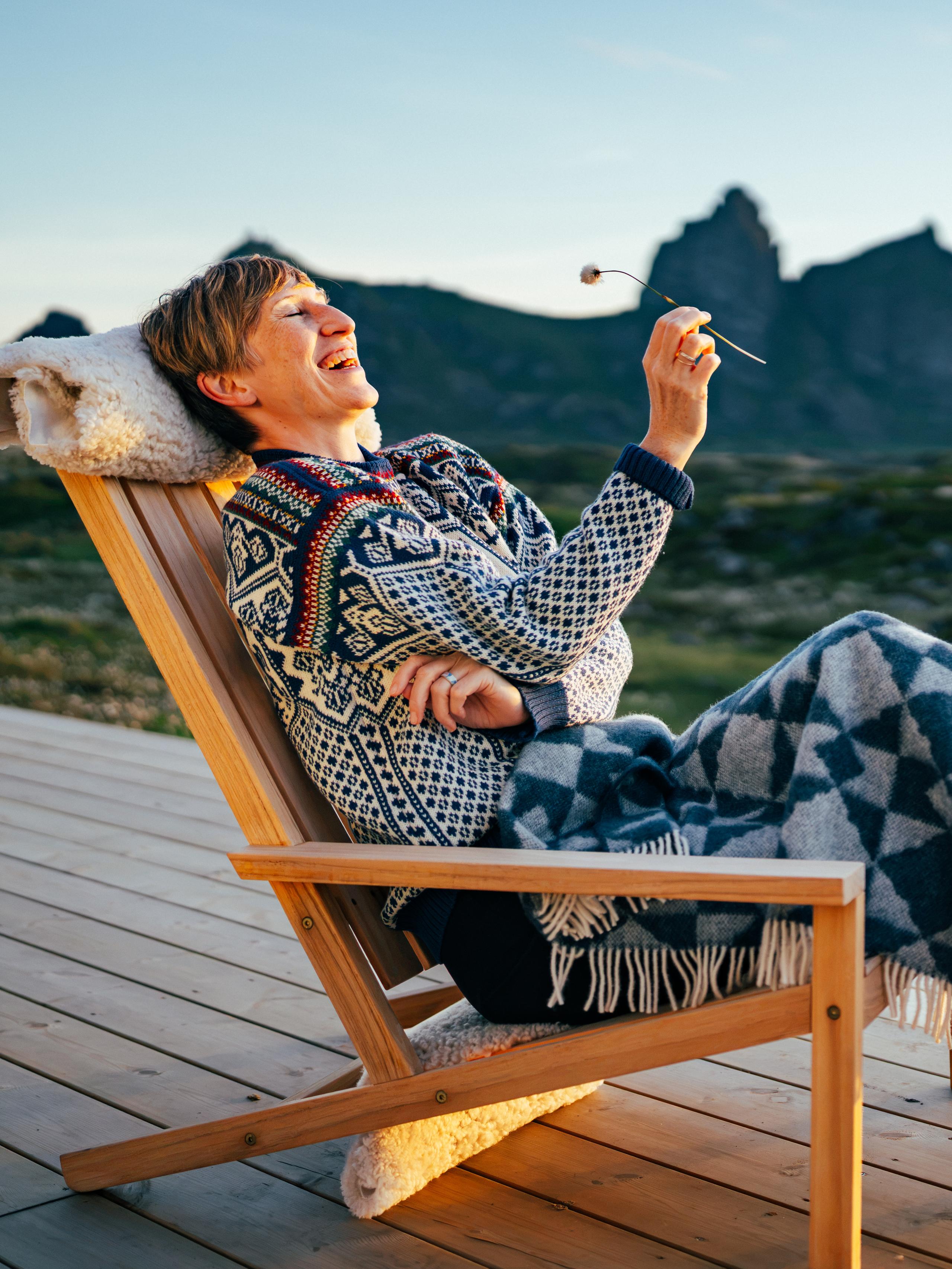 A Woman in a chair at Ytri Island Retreat at Træna