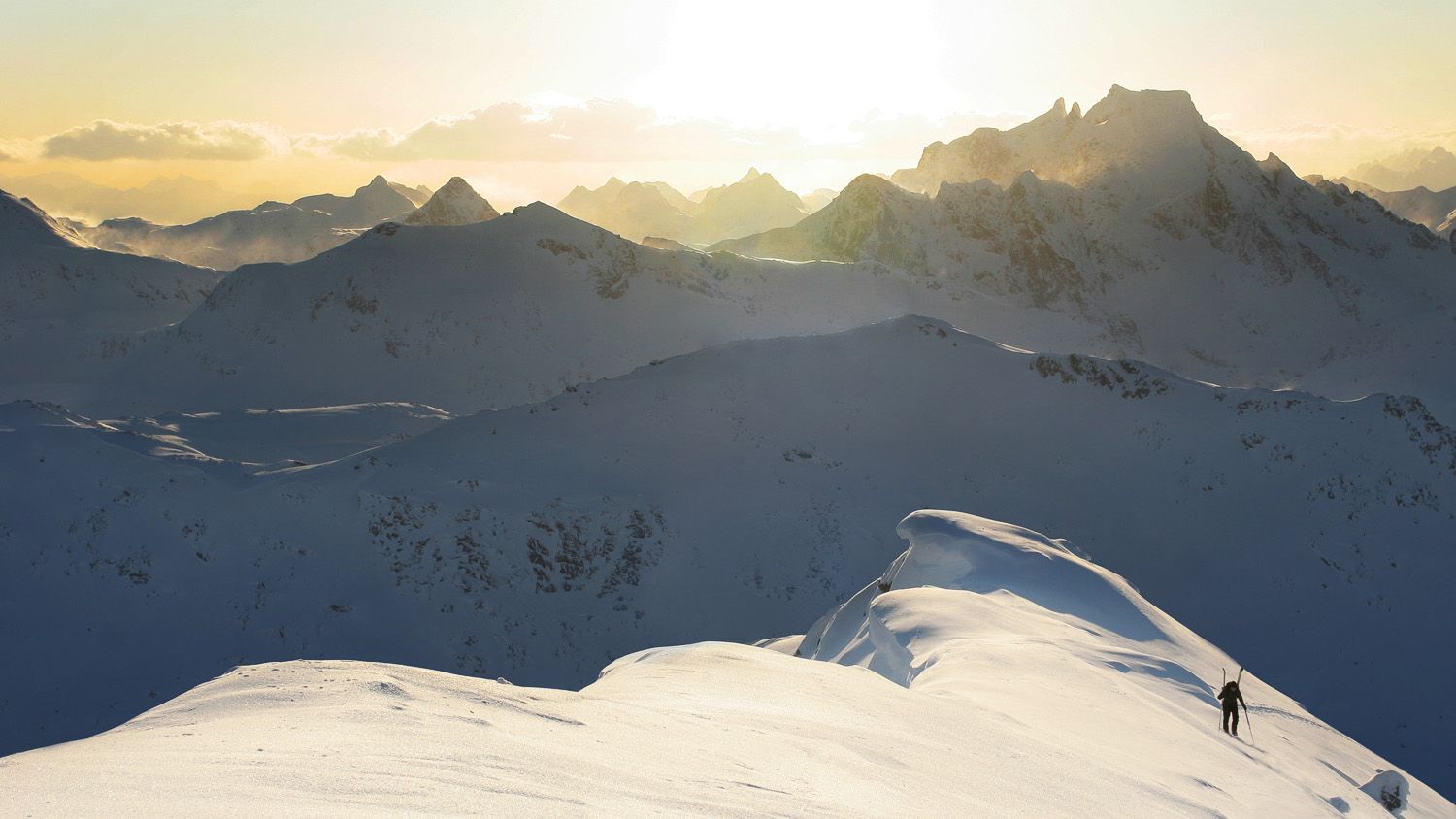 A person ski touring on a mountain in Northern Norway
