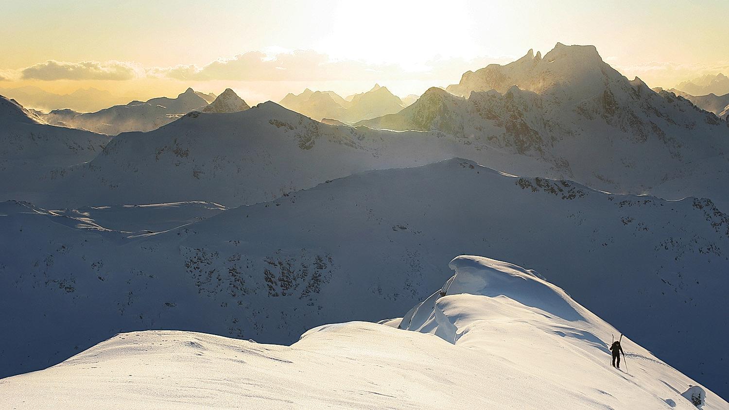A person ski touring on a mountain in Northern Norway