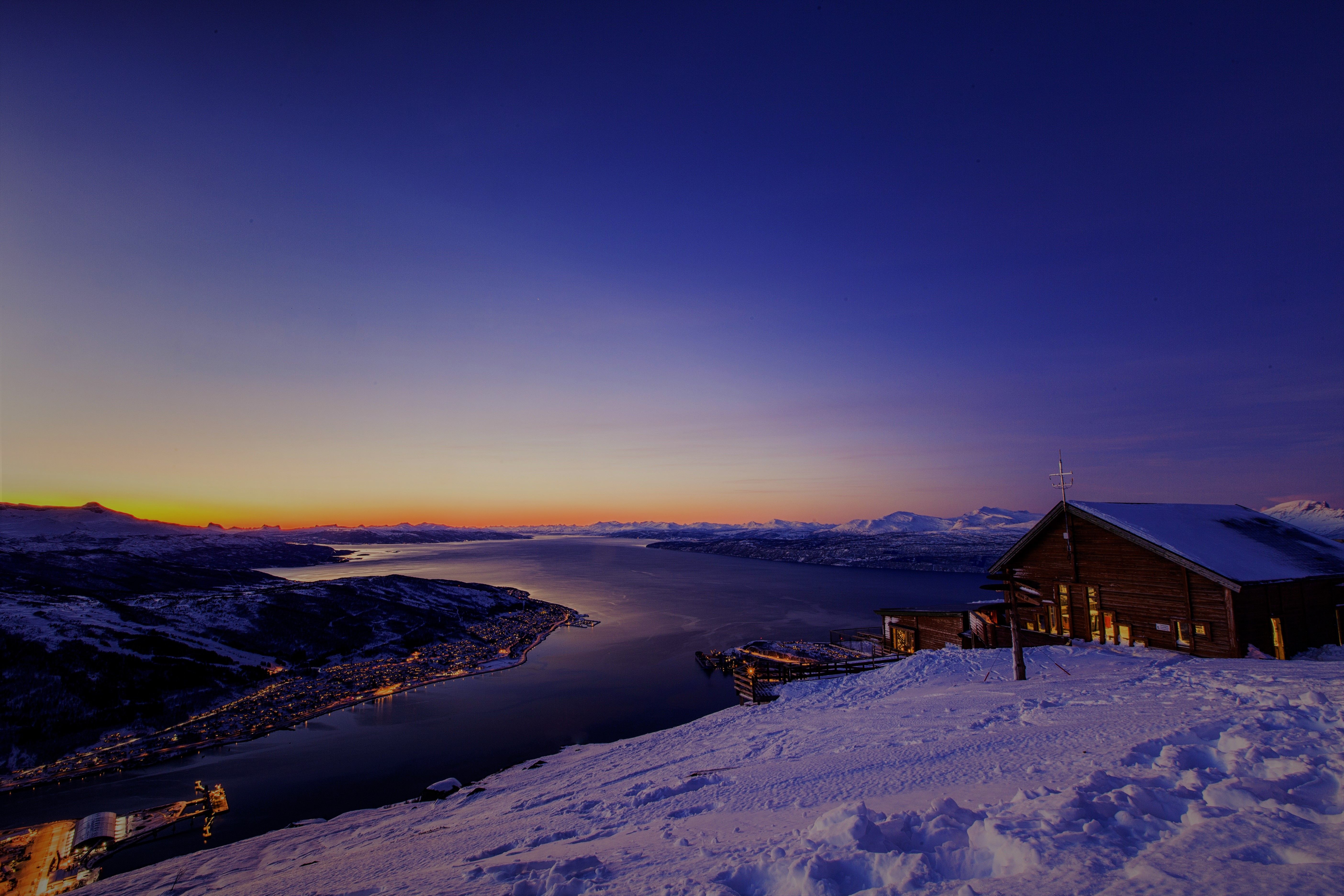 A snowy landscape with a sunset.