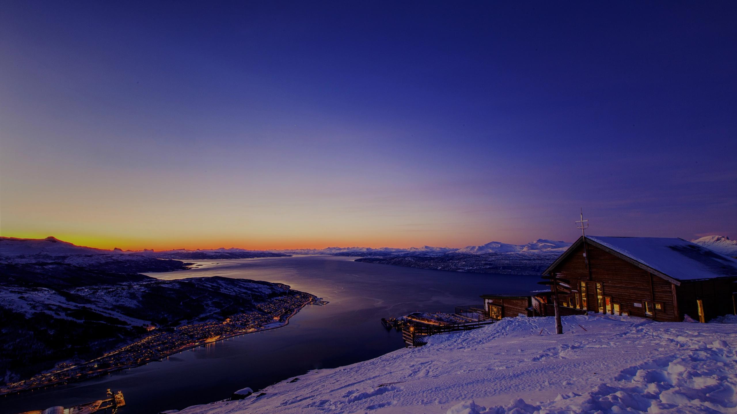 A snowy landscape with a sunset.