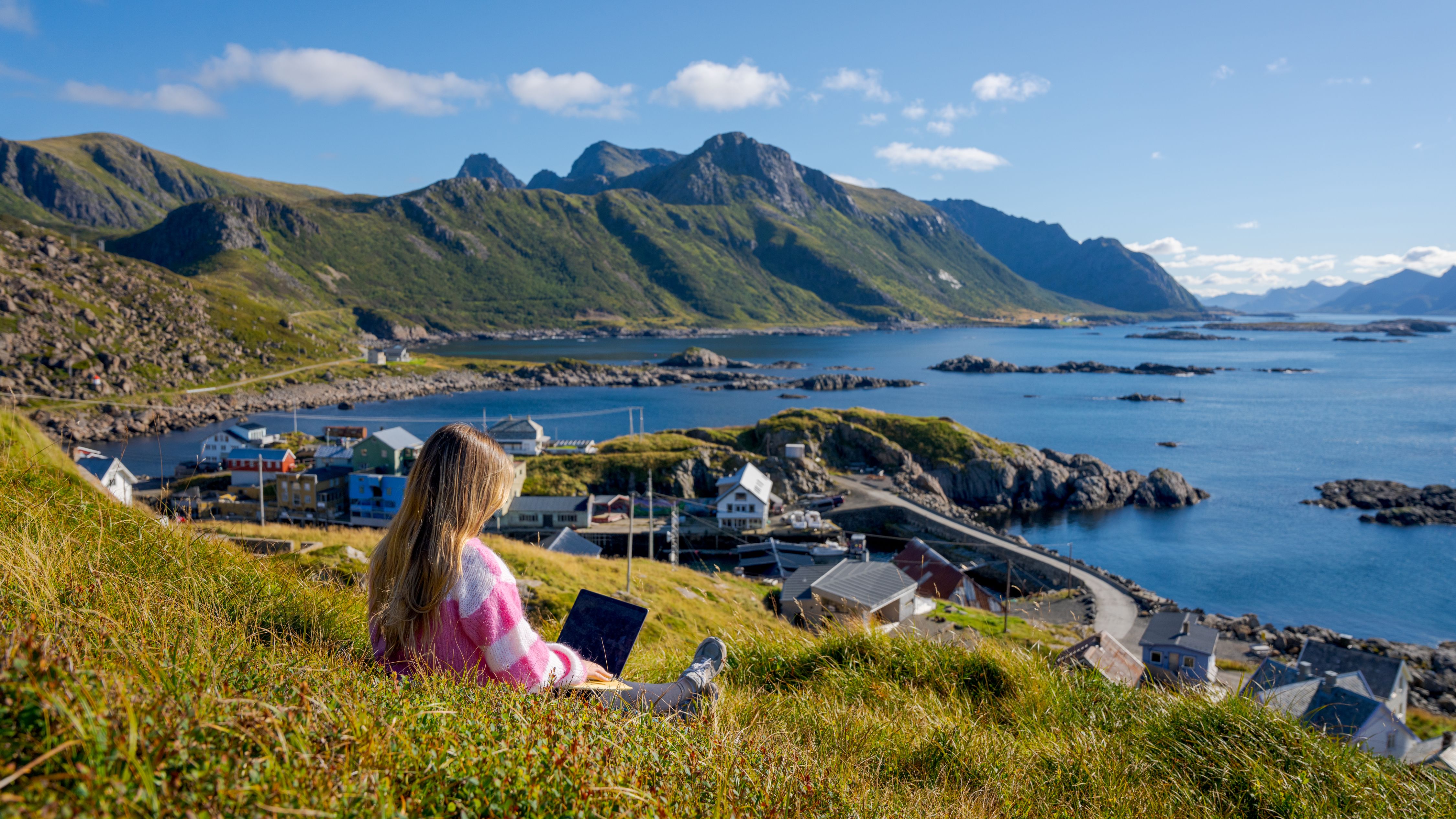 A woman working remotely from Nyksund, in stunning scenery