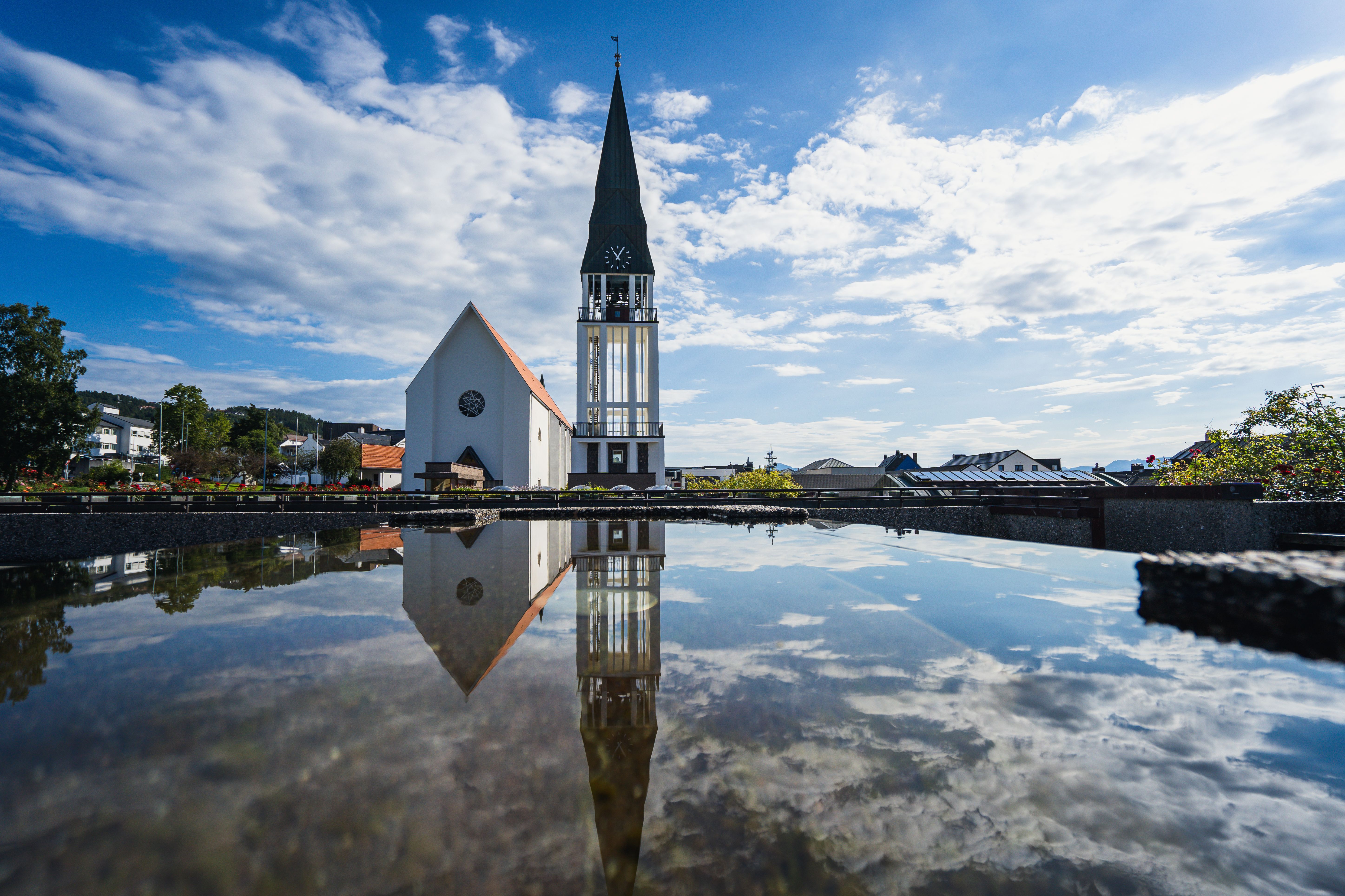 Molde Cathedral with a small reflecting pool in front. 