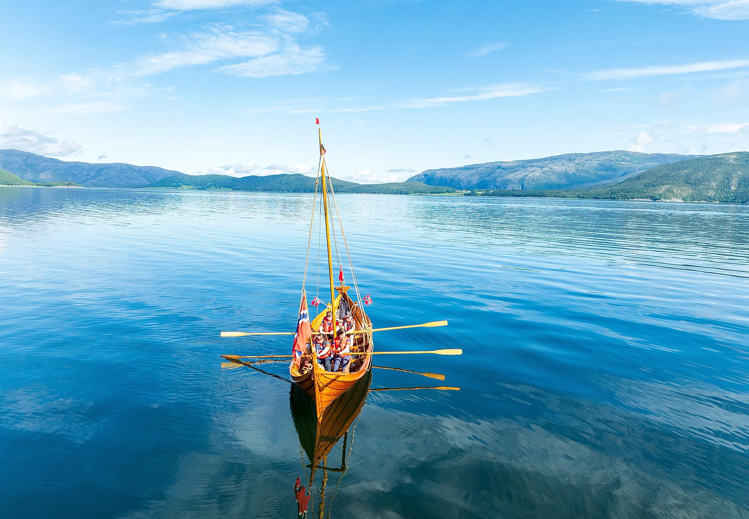 A replica of a viking boat in a fjord