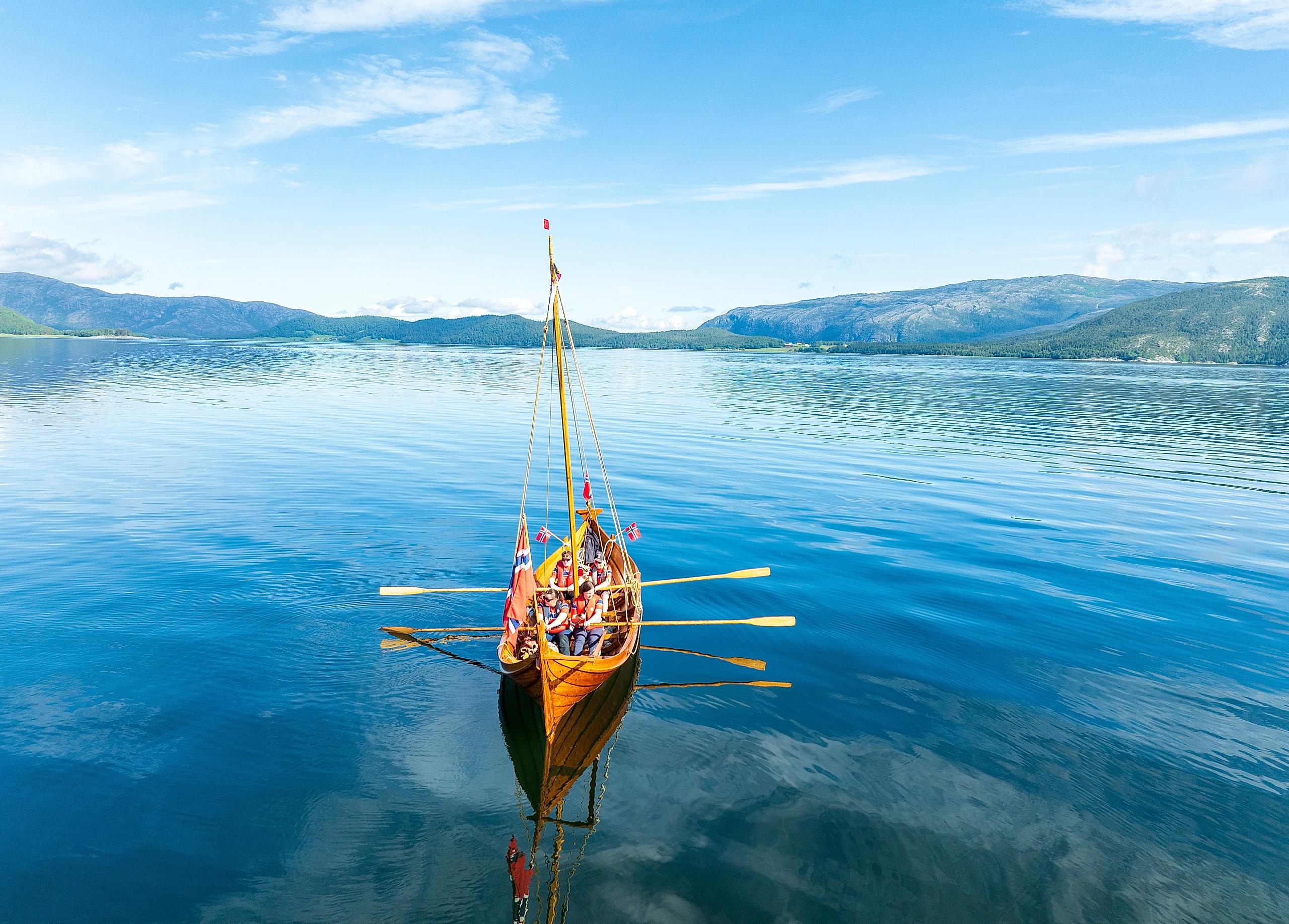 A replica of a viking boat in a fjord