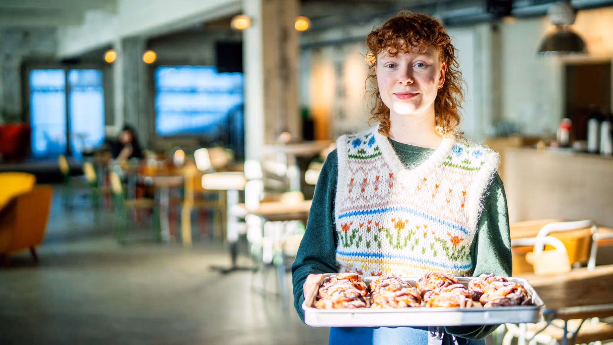 Woman with cinnamon buns