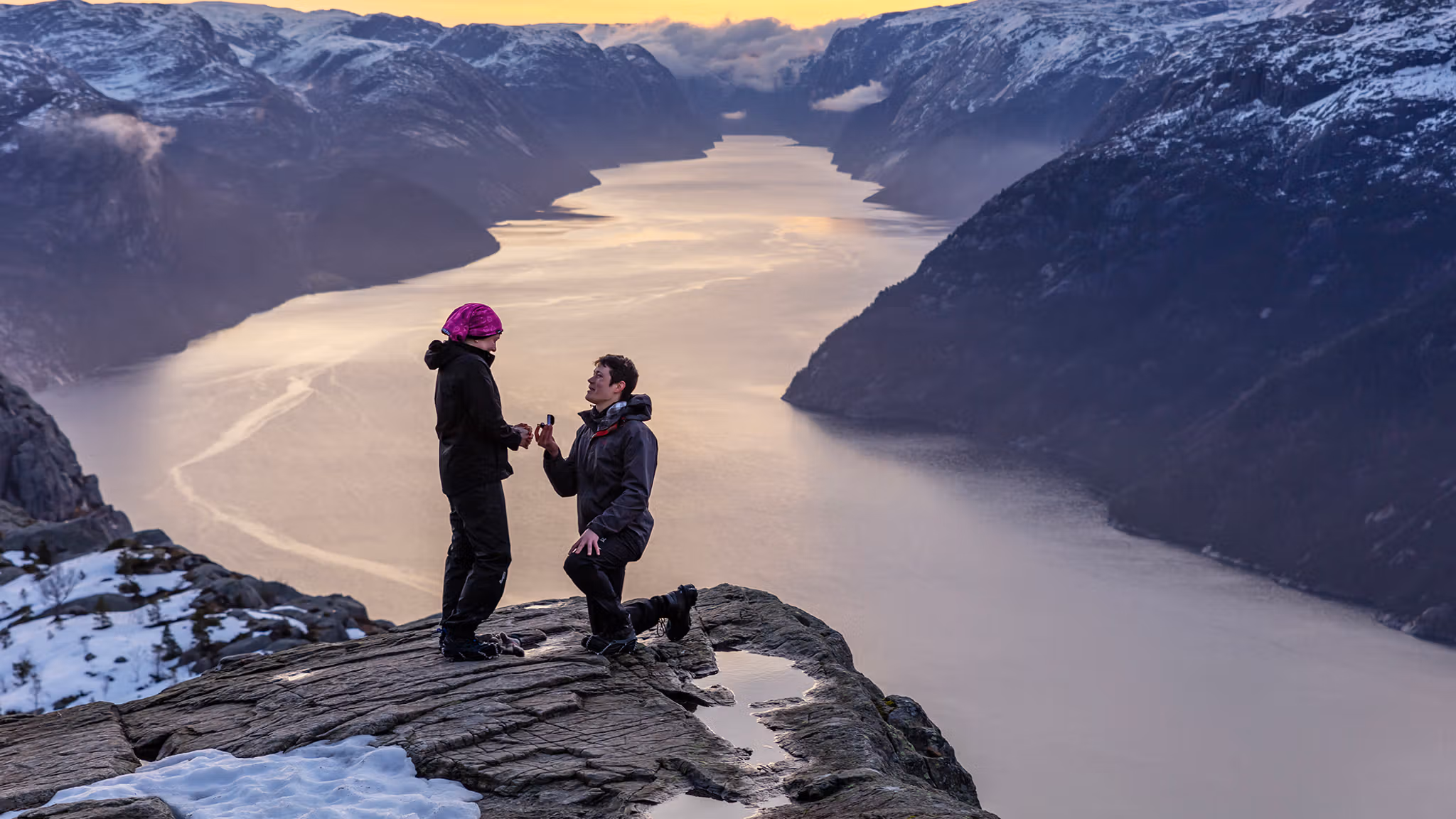 Man proposing to woman at Preikestolen mountain