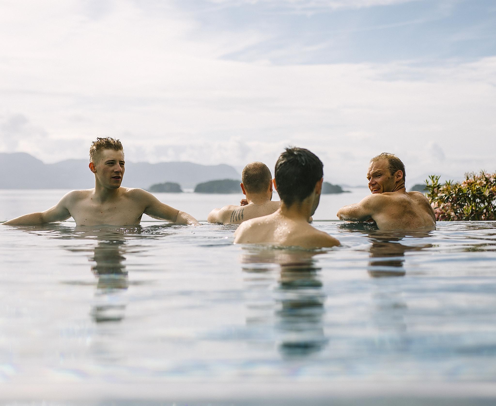 Four men in an outdoor pool in Fjord Norway
