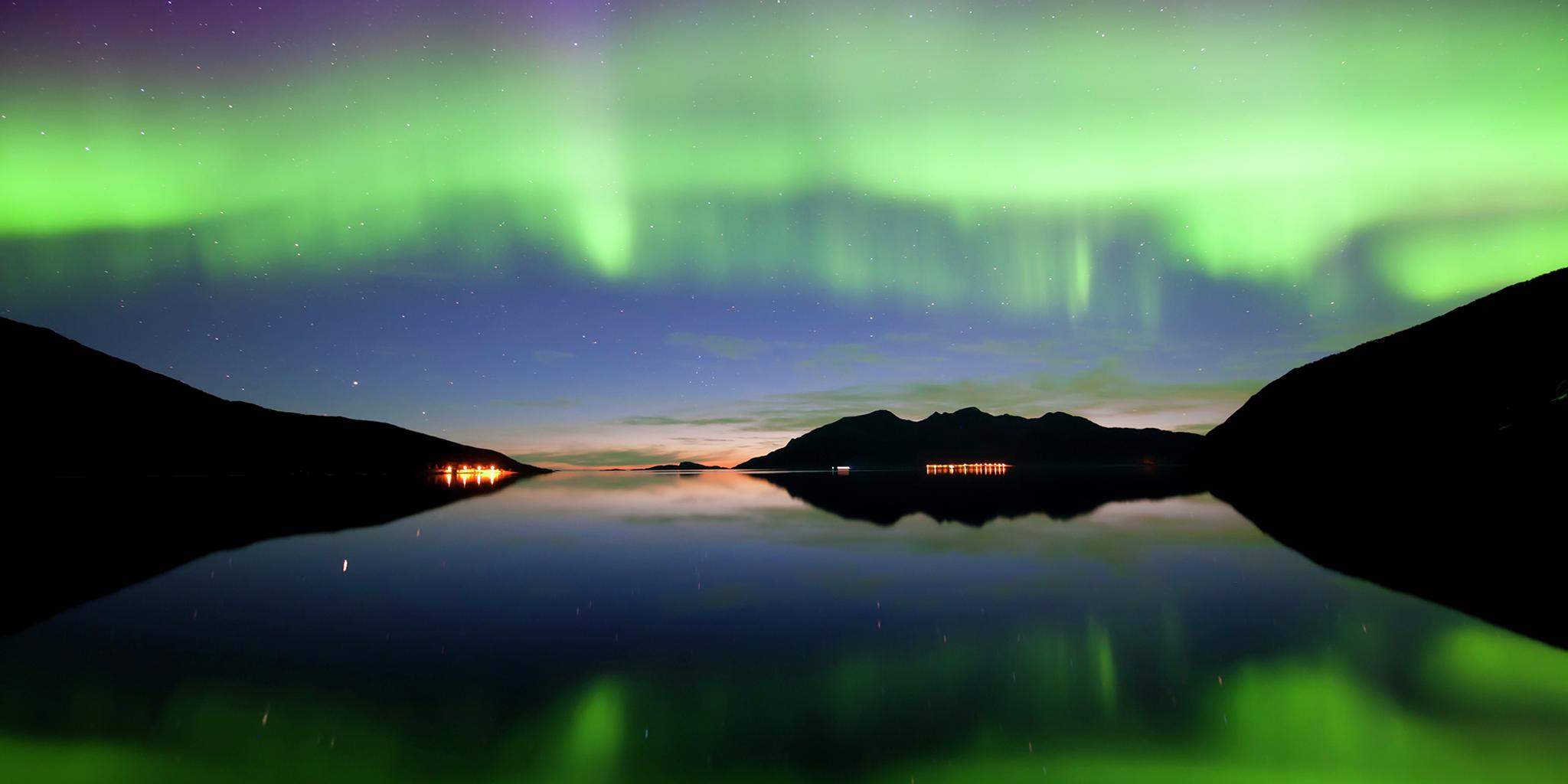 Northern lights over Grøtfjord in Kvaløya, Northern Norway