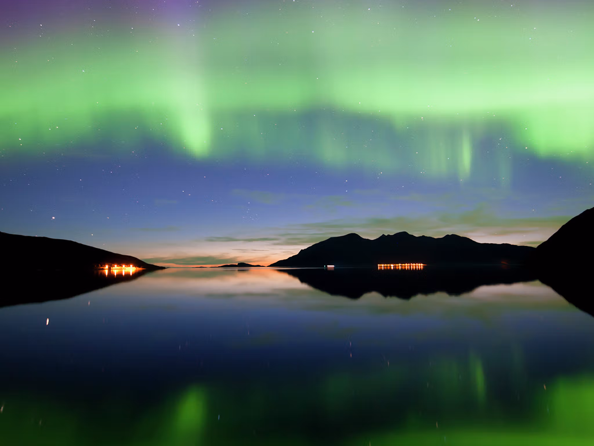 Northern lights over Grøtfjord in Kvaløya, Northern Norway