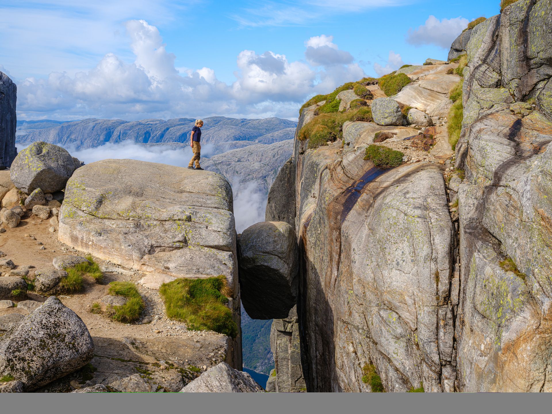 A boulder lodged in a cliff.