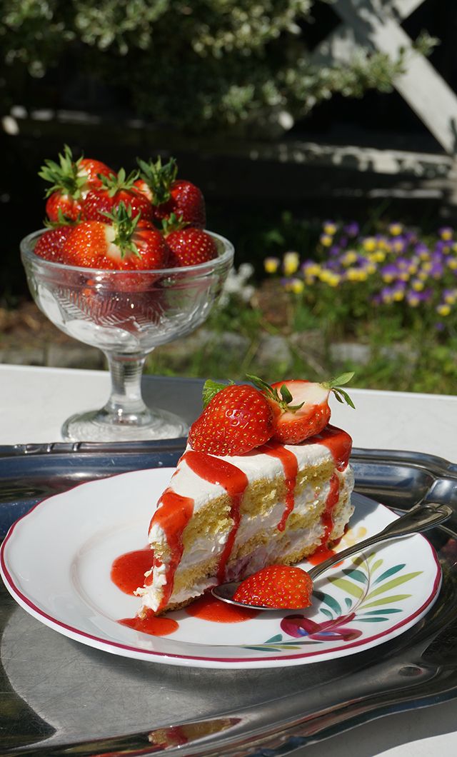 A cake topped with strawberries in the strawberry village Valldal in Fjord Norway