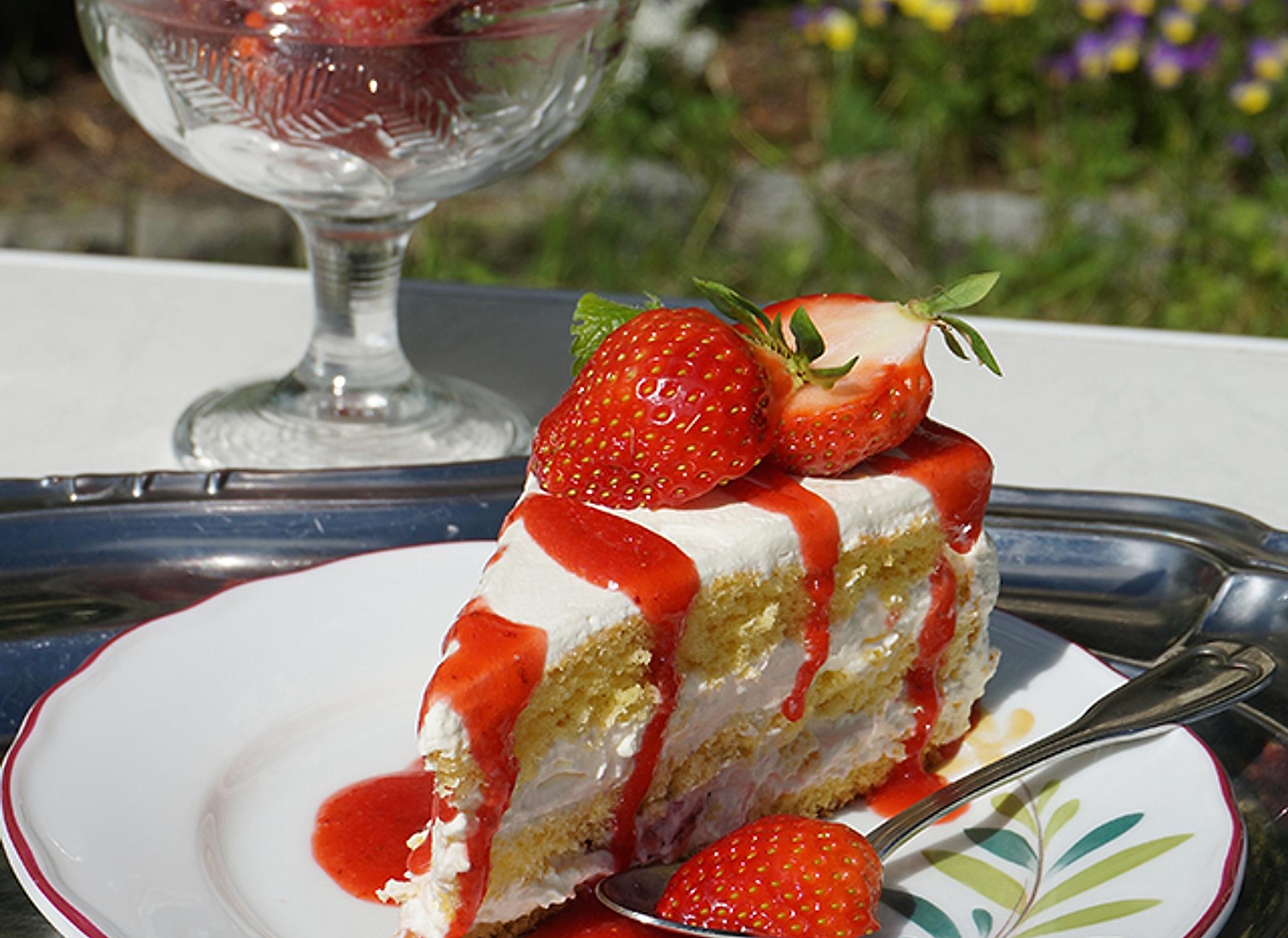 A cake topped with strawberries in the strawberry village Valldal in Fjord Norway