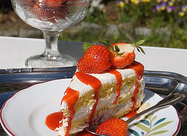 A cake topped with strawberries in the strawberry village Valldal in Fjord Norway
