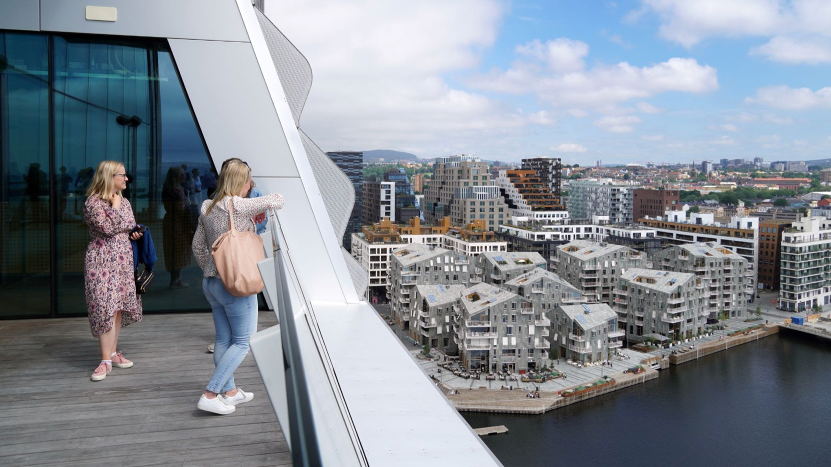 Three women on top of the Munch Museum looking at the view