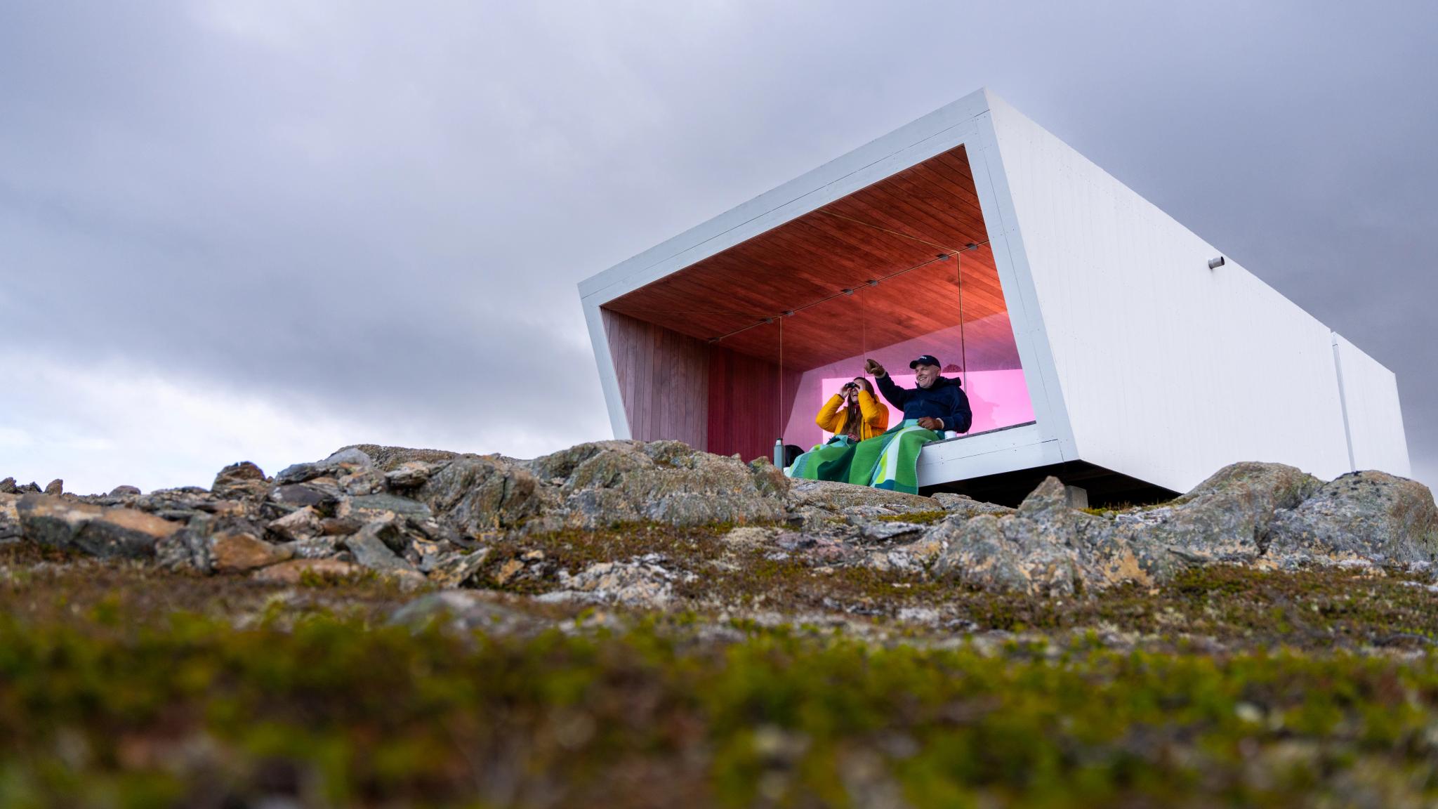 Two people sitting in Domen viewpoint by Biptope in Varanger, Northern Norway