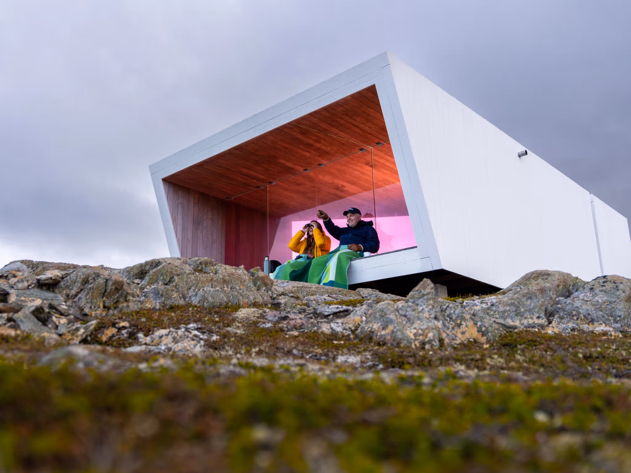 Two people sitting in Domen viewpoint by Biptope in Varanger, Northern Norway