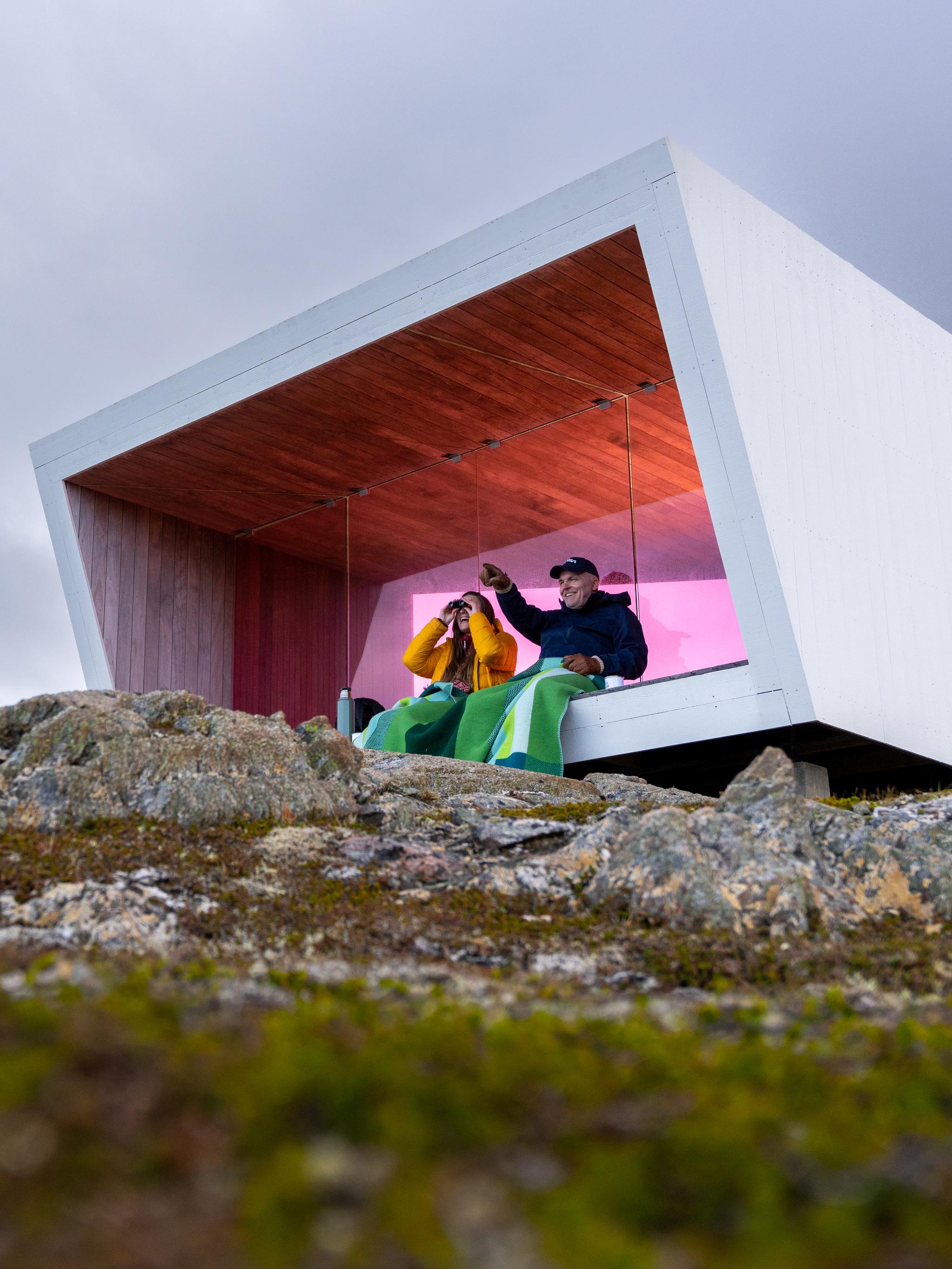 Two people sitting in Domen viewpoint by Biptope in Varanger, Northern Norway