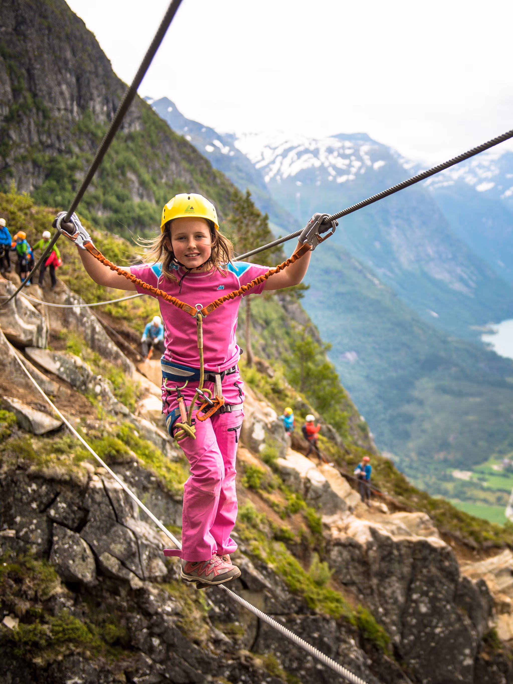 Young girl crossing the Via Ferrata in Loen in Fjord Norway