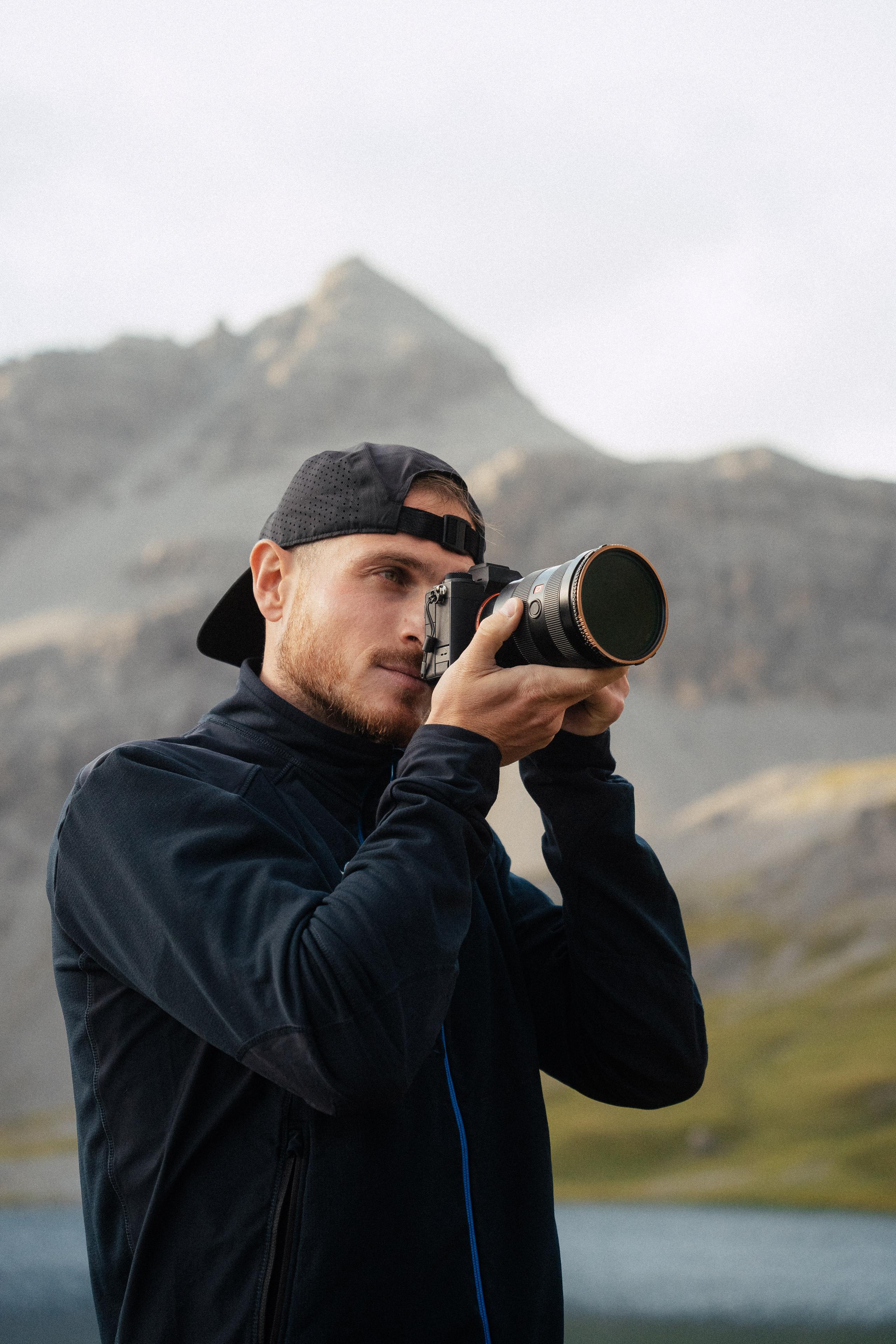 A photographer holding a camera.