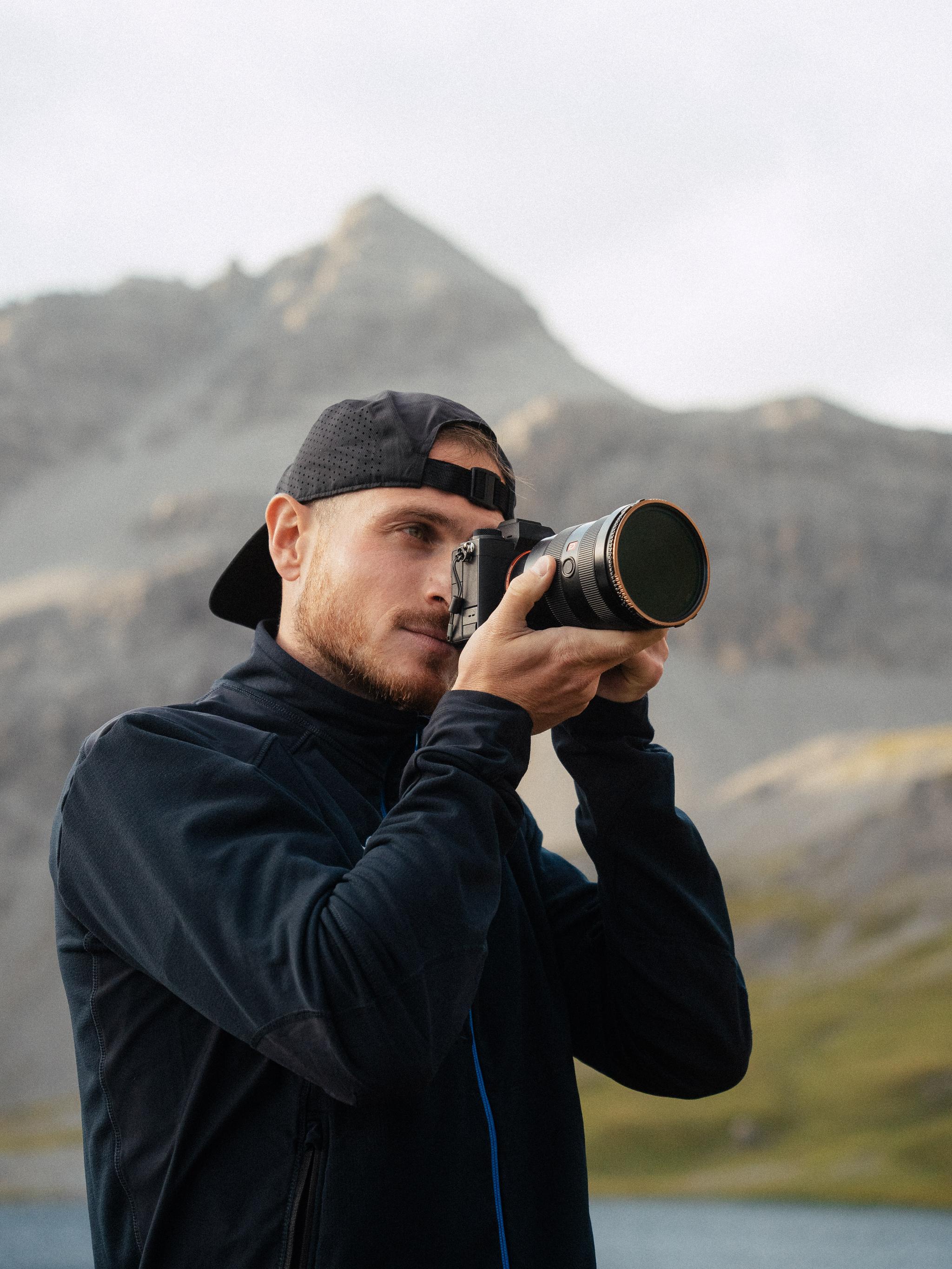 A photographer holding a camera.