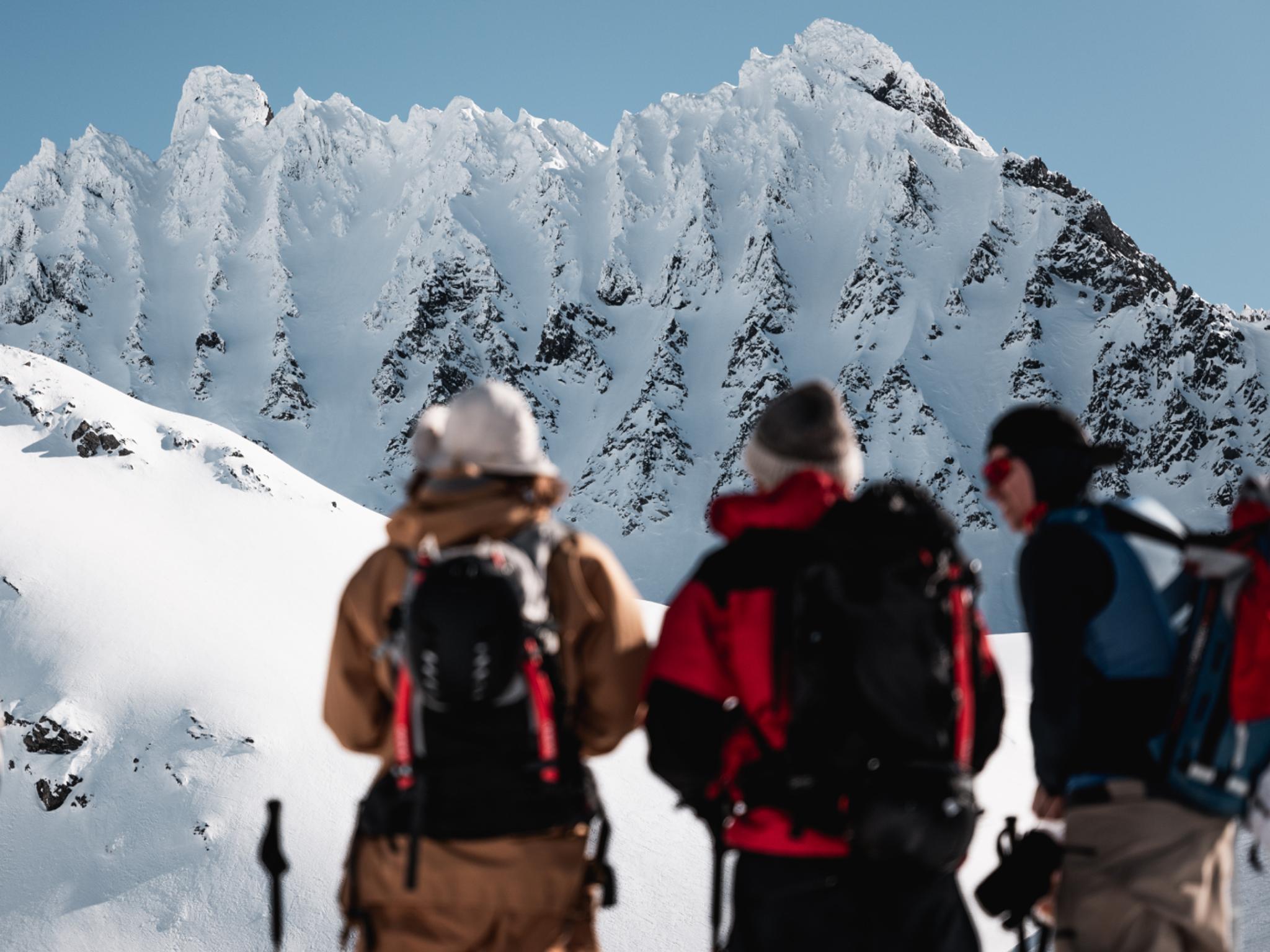 A group of people ski touring to Smørskredtindane in Ørsta and Stranda at Sunnmøre in Fjord Norway