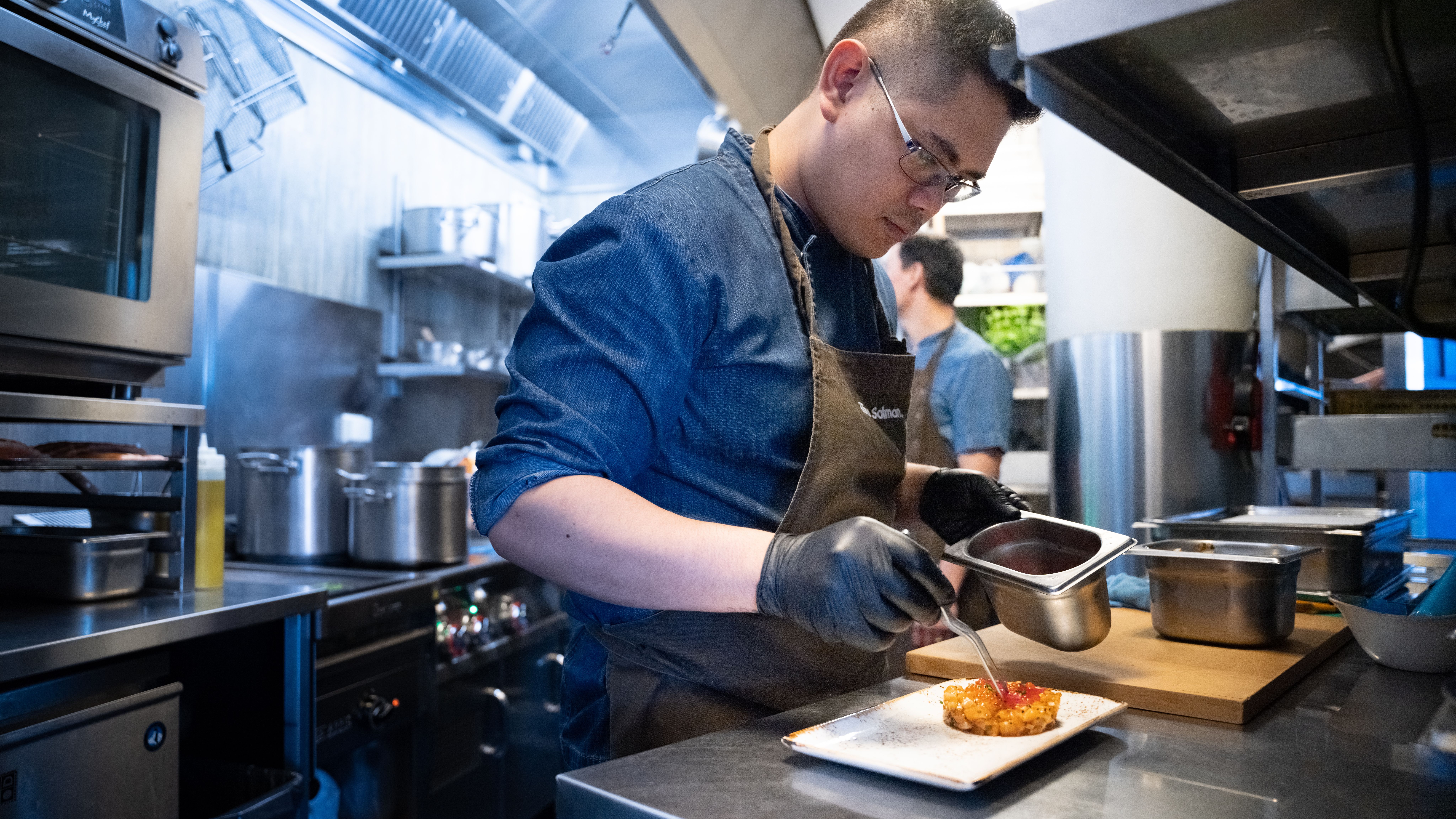 Chef Harry Hermosa making salmon tartar at The Salmon, Tjuvholmen in Oslo