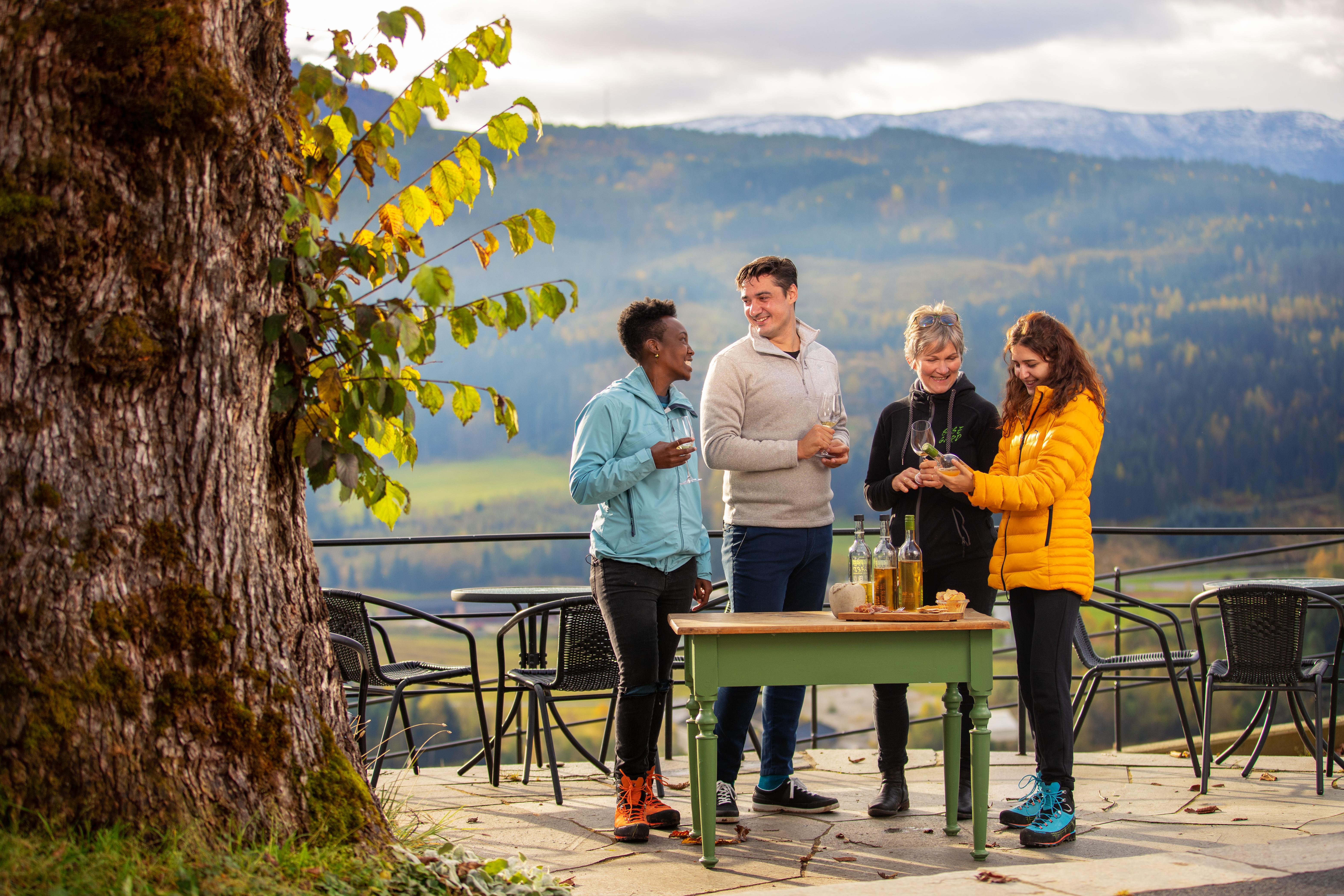 A group of people tasting ciders at Syse gard in Hardanger, Fjord Norway