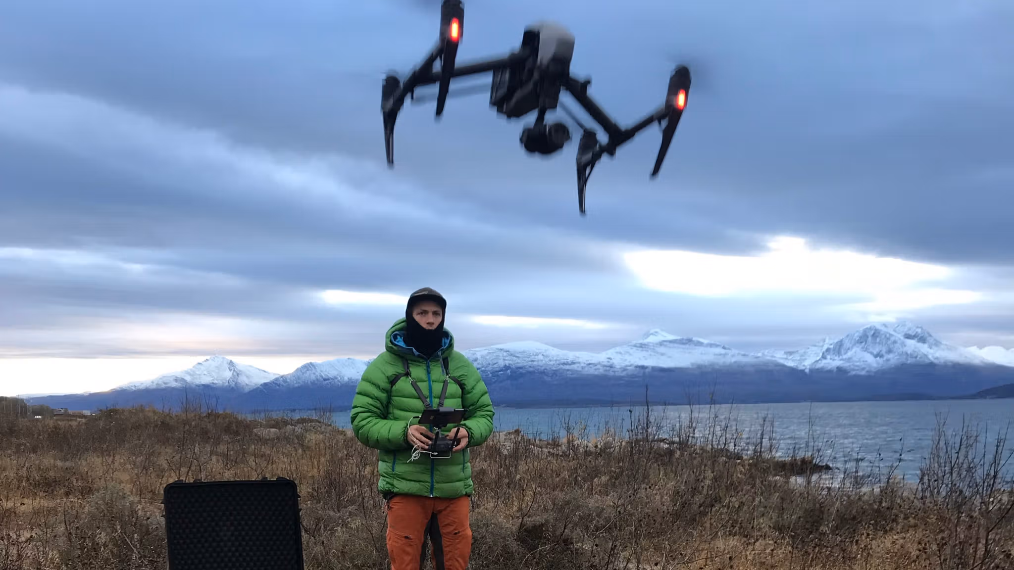 Man flying a drone in nature