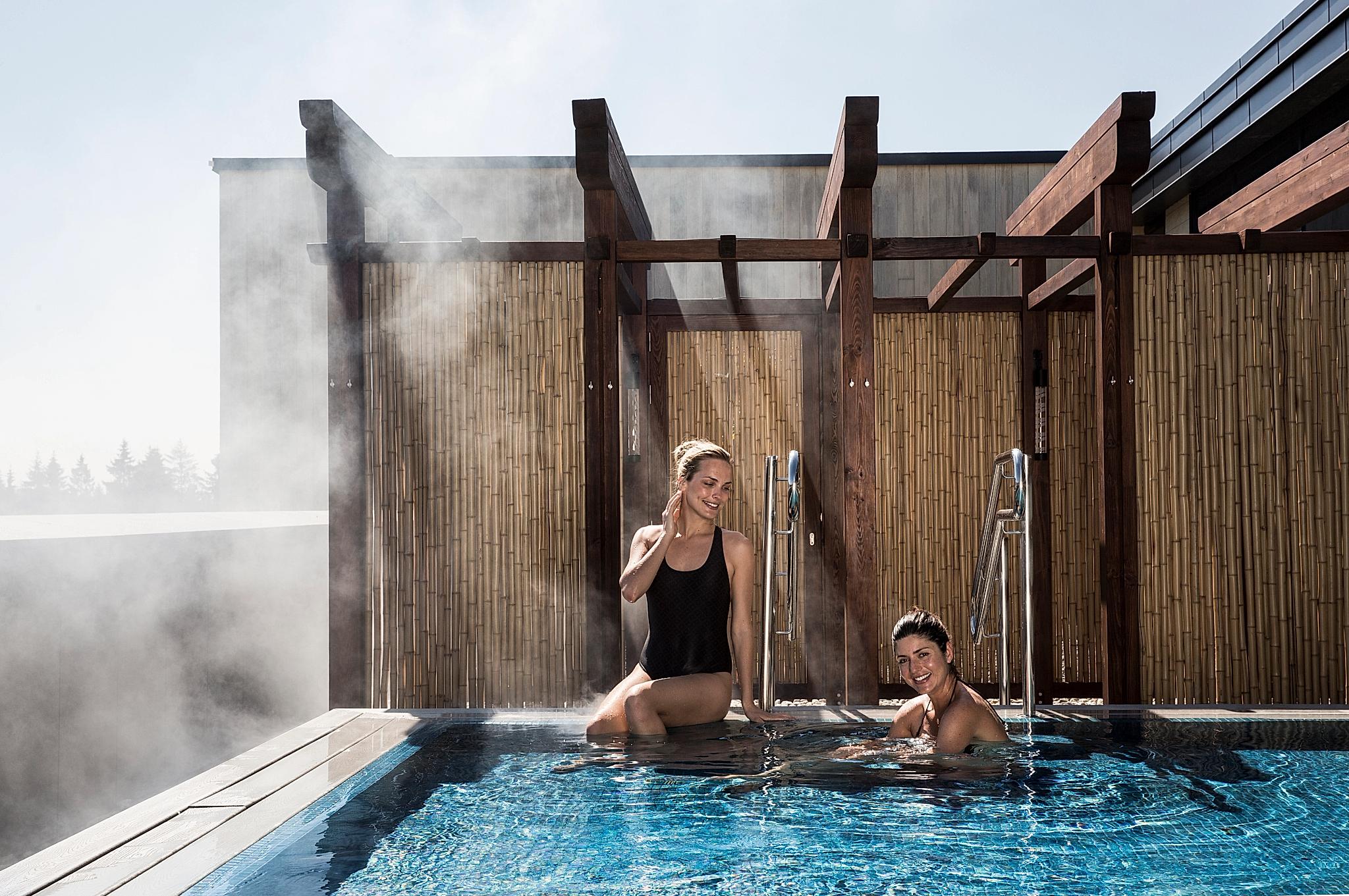 Two women in a pool at The Well, Akershus, Eastern Norway