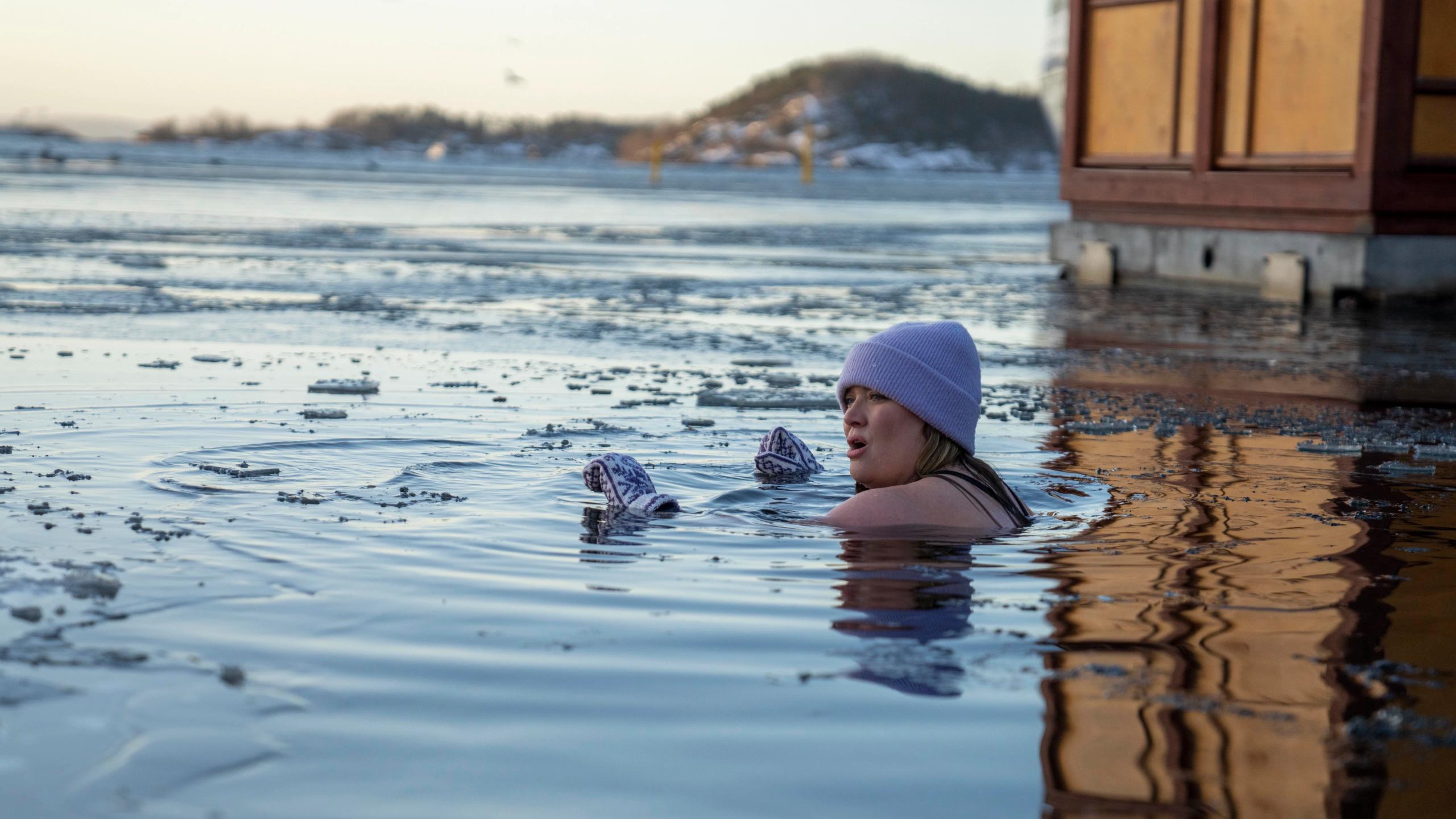 A girl ice bathing in the Oslo fjord, Eastern Norway
