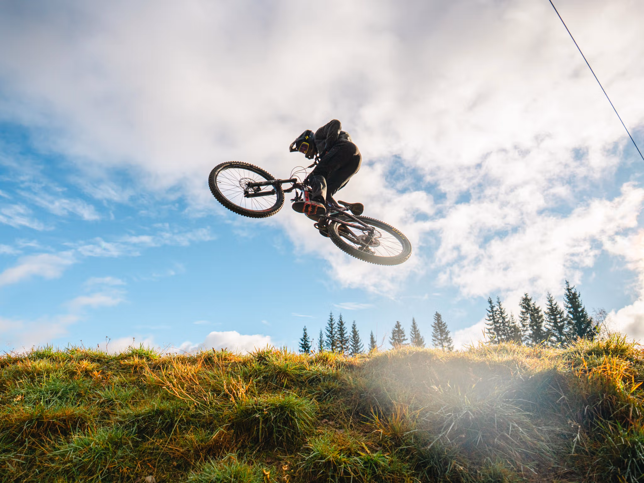 A boy on a bike in mid-air.
