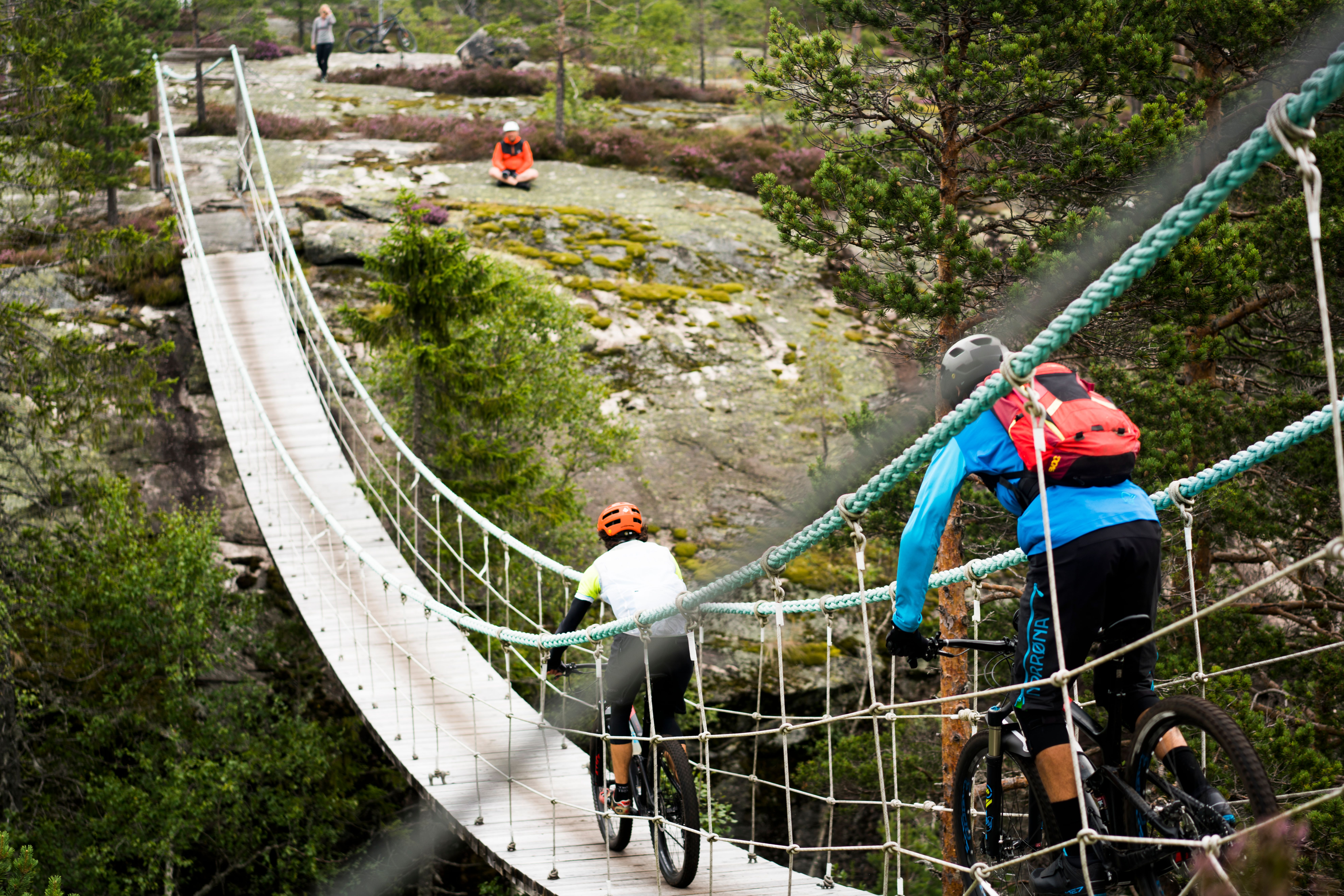 People mountain biking by Canvas Hotel in Norway